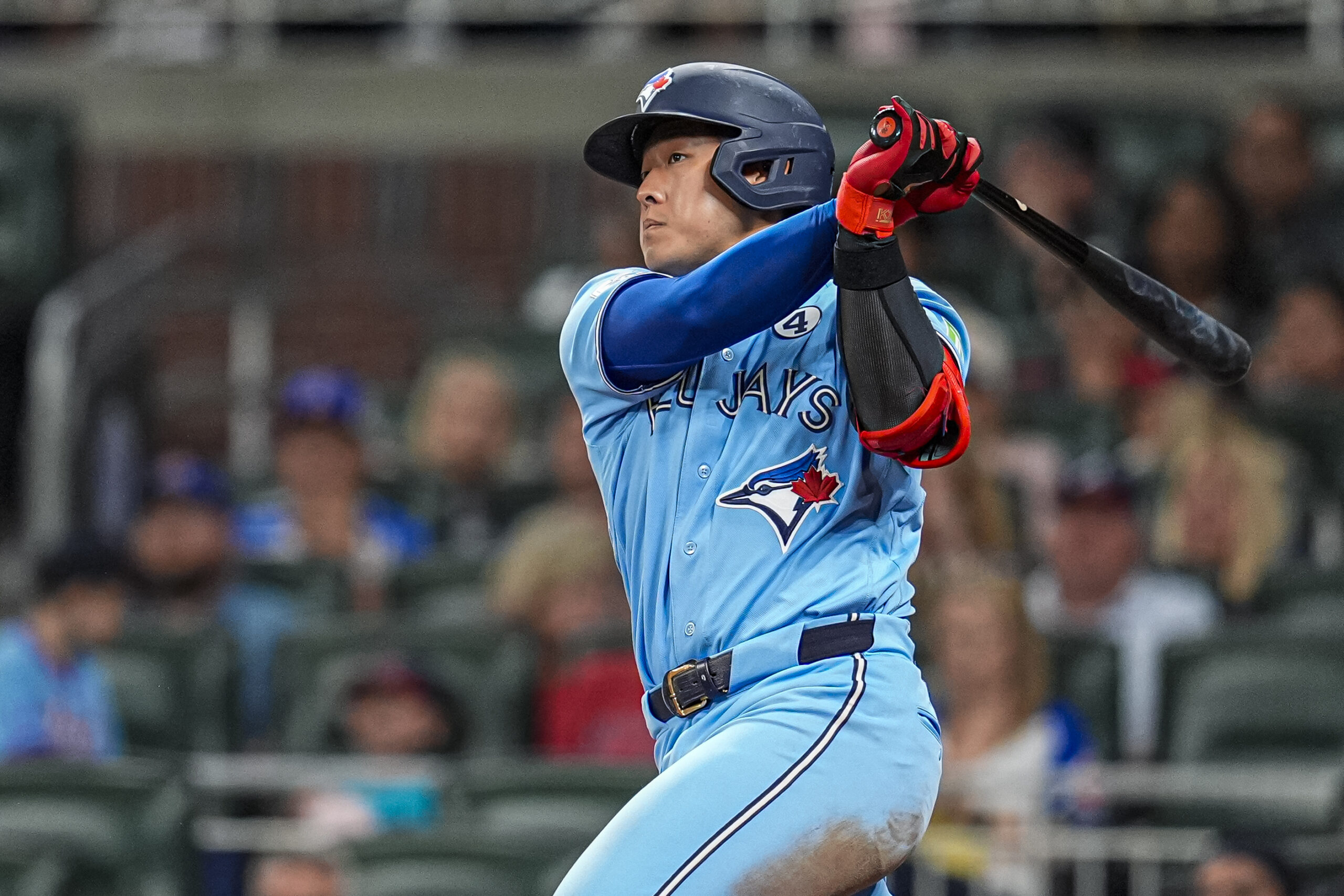 Jun 2, 2026; Cumberland, Georgia, USA; Toronto Blue Jays third baseman Kazuma Okamoto (7) hits a single against the Atlanta Braves during the ninth inning at Truist Park. Mandatory Credit: Dale Zanine-Imagn Images
