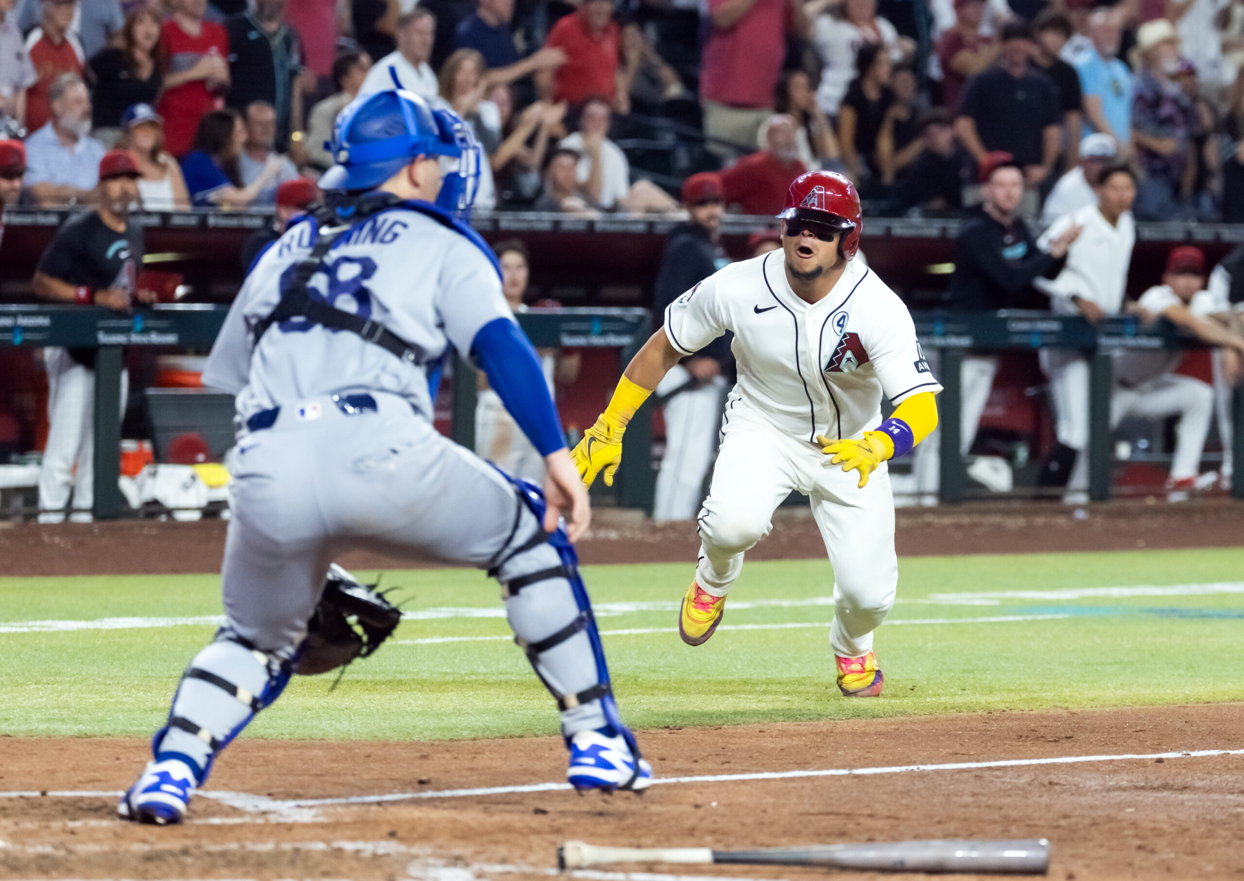 Jun 2, 2026; Phoenix, Arizona, USA; Arizona Diamondbacks base runner Gabriel Moreno (right) dives into home ahead of the tag by Los Angeles Dodgers catcher Dalton Rushing in the seventh inning at Chase Field. Mandatory Credit: Mark J. Rebilas-Imagn Images