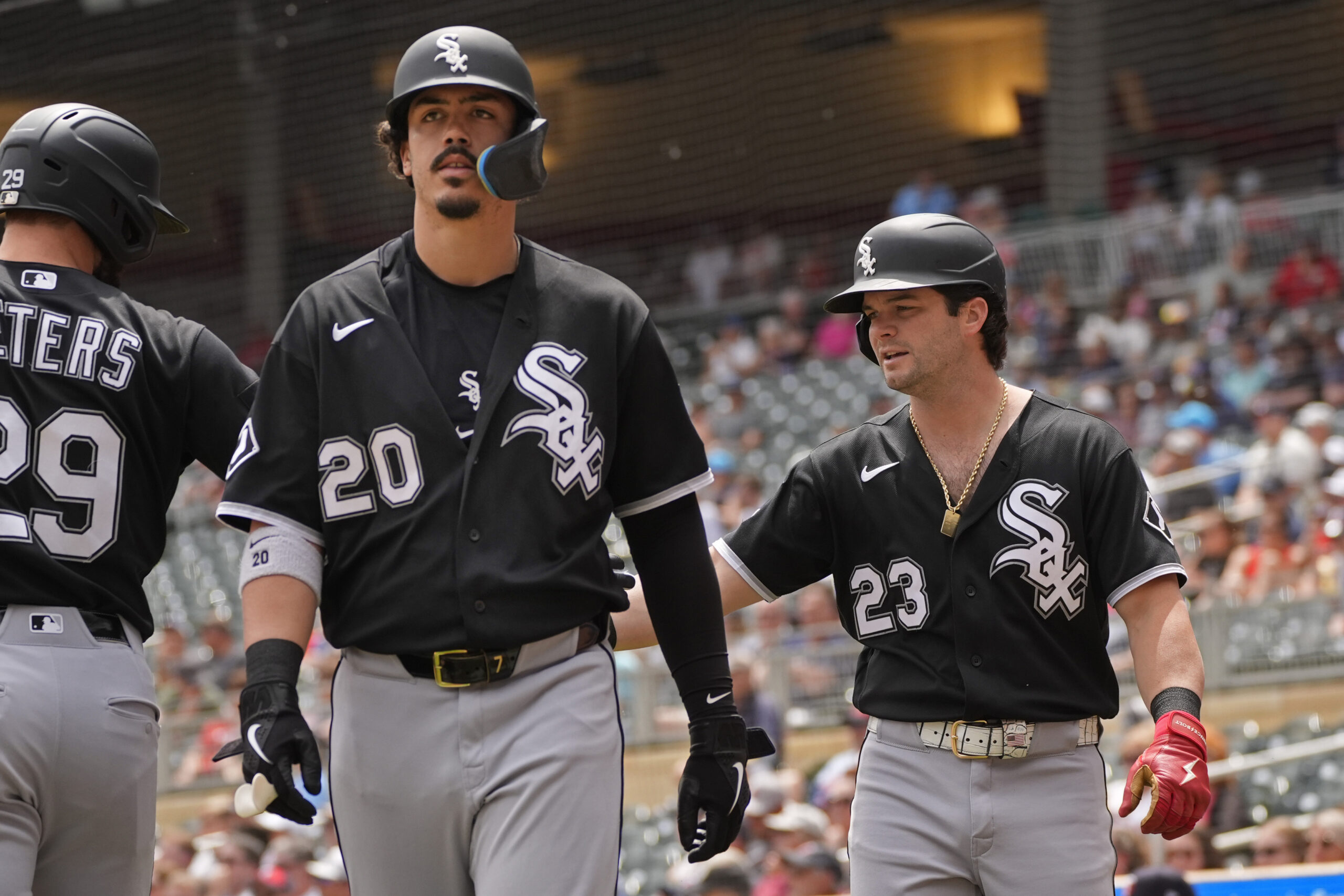 Jun 3, 2026; Minneapolis, Minnesota, USA; Chicago White Sox third baseman Miguel Vargas (20) and designated hitter Andrew Benintendi (23) celebrate their runs against the Minnesota Twins on a single by first baseman Jacob Gonzalez (not pictured) in the first inning at Target Field. Mandatory Credit: Bruce Kluckhohn-Imagn Images