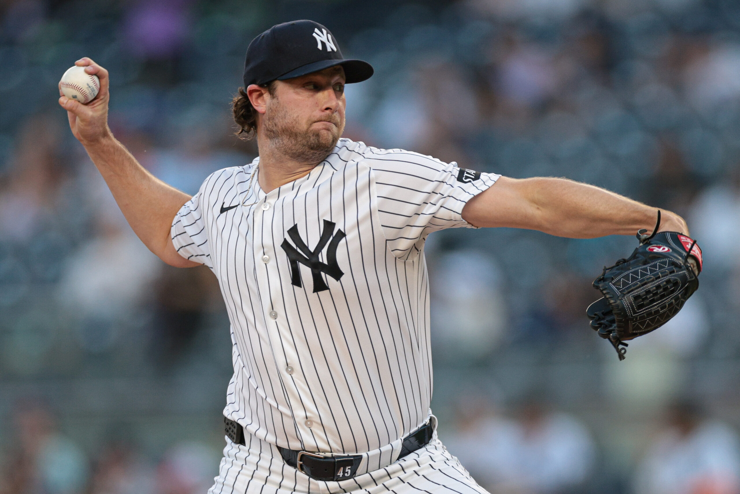 Jun 3, 2026; Bronx, New York, USA; New York Yankees pitcher Gerrit Cole (45) delivers a pitch during the first inning against the Cleveland Guardians at Yankee Stadium. Mandatory Credit: Vincent Carchietta-Imagn Images