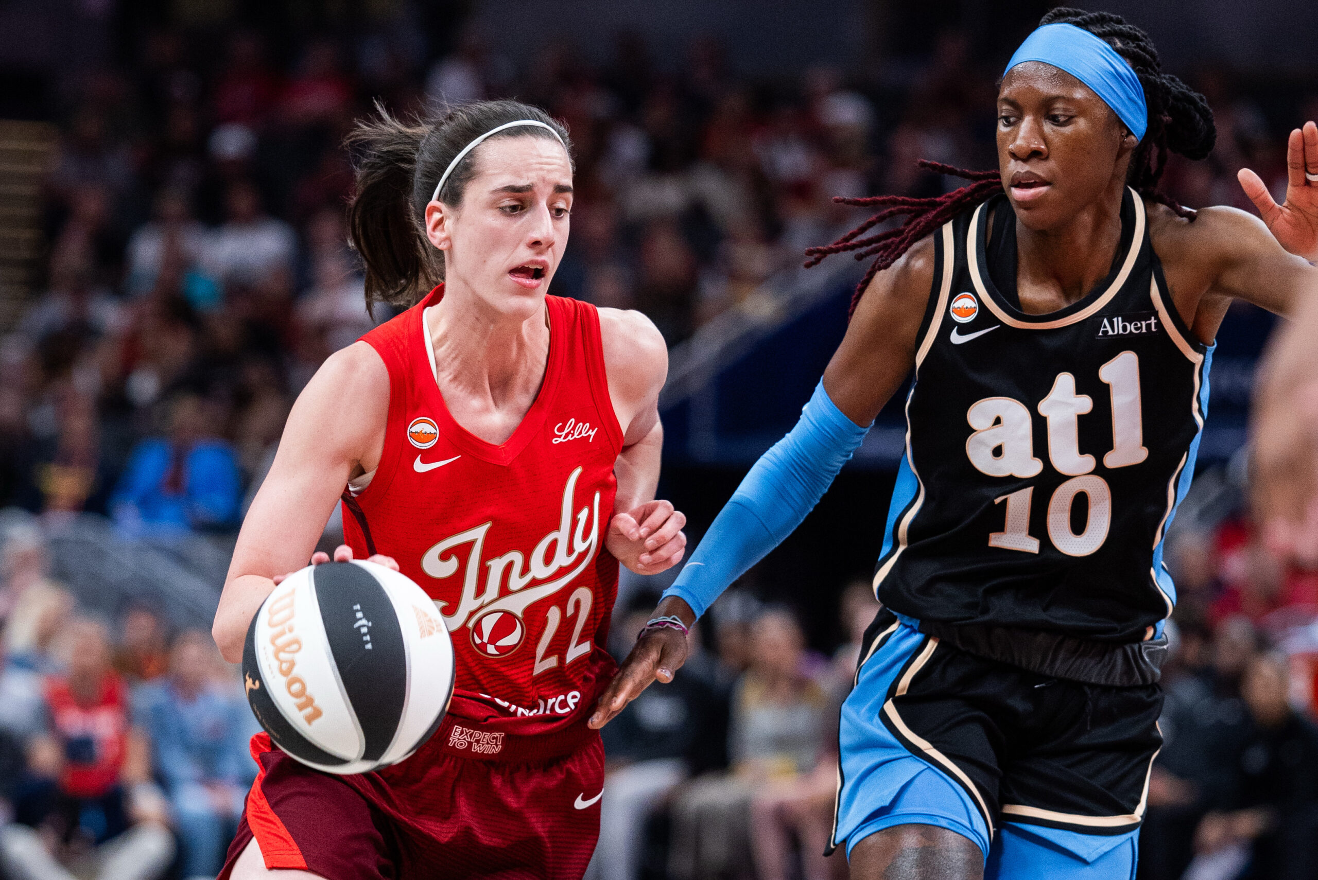 Jun 4, 2026; Indianapolis, Indiana, USA; Indiana Fever guard Caitlin Clark (22) dribbles the ball against Atlanta Dream guard Rhyne Howard (10) during the first half at Gainbridge Fieldhouse. Mandatory Credit: Trevor Ruszkowski-Imagn Images
