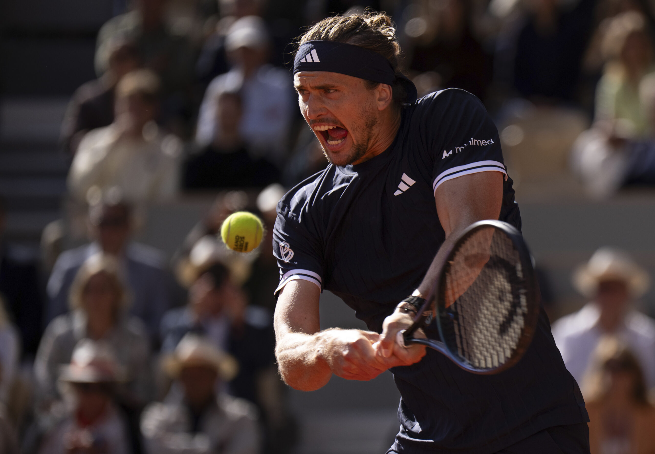 Jun 5, 2026; Paris, France;  Alexander Zverev of Germany returns a shot during his match against Jakub Mensik of Czechia on day 12 at Stade Roland Garros. Mandatory Credit: Susan Mullane-Imagn Images