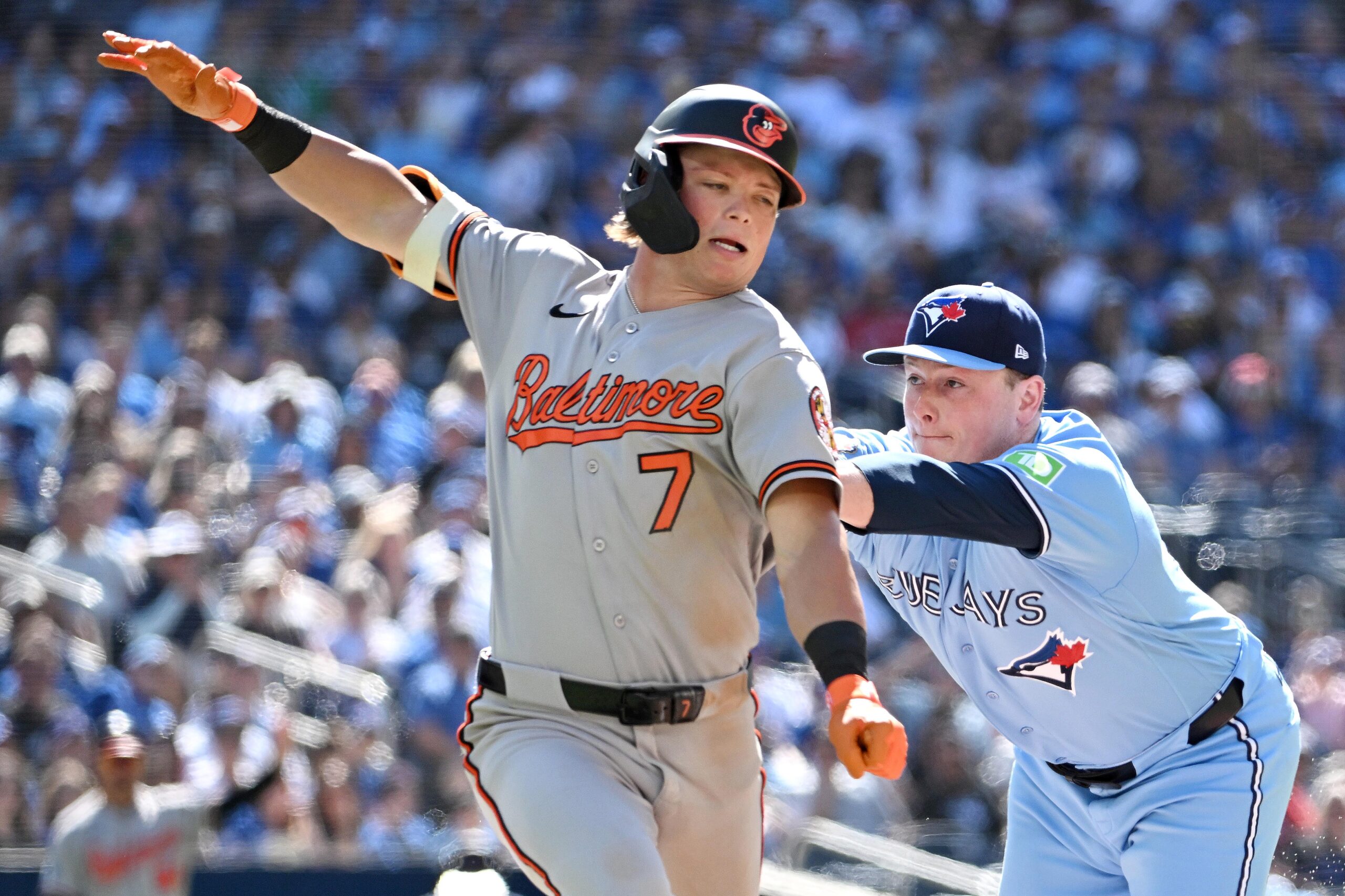 Jun 7, 2026; Toronto, Ontario, CAN; Baltimore Orioles second baseman Jackson Holliday (7) is called out for running off the baseline to avoid a tage from Toronto Blue Jays pitcher Louis Varland (77) in the ninth inning at Rogers Centre. Mandatory Credit: Dan Hamilton-Imagn Images