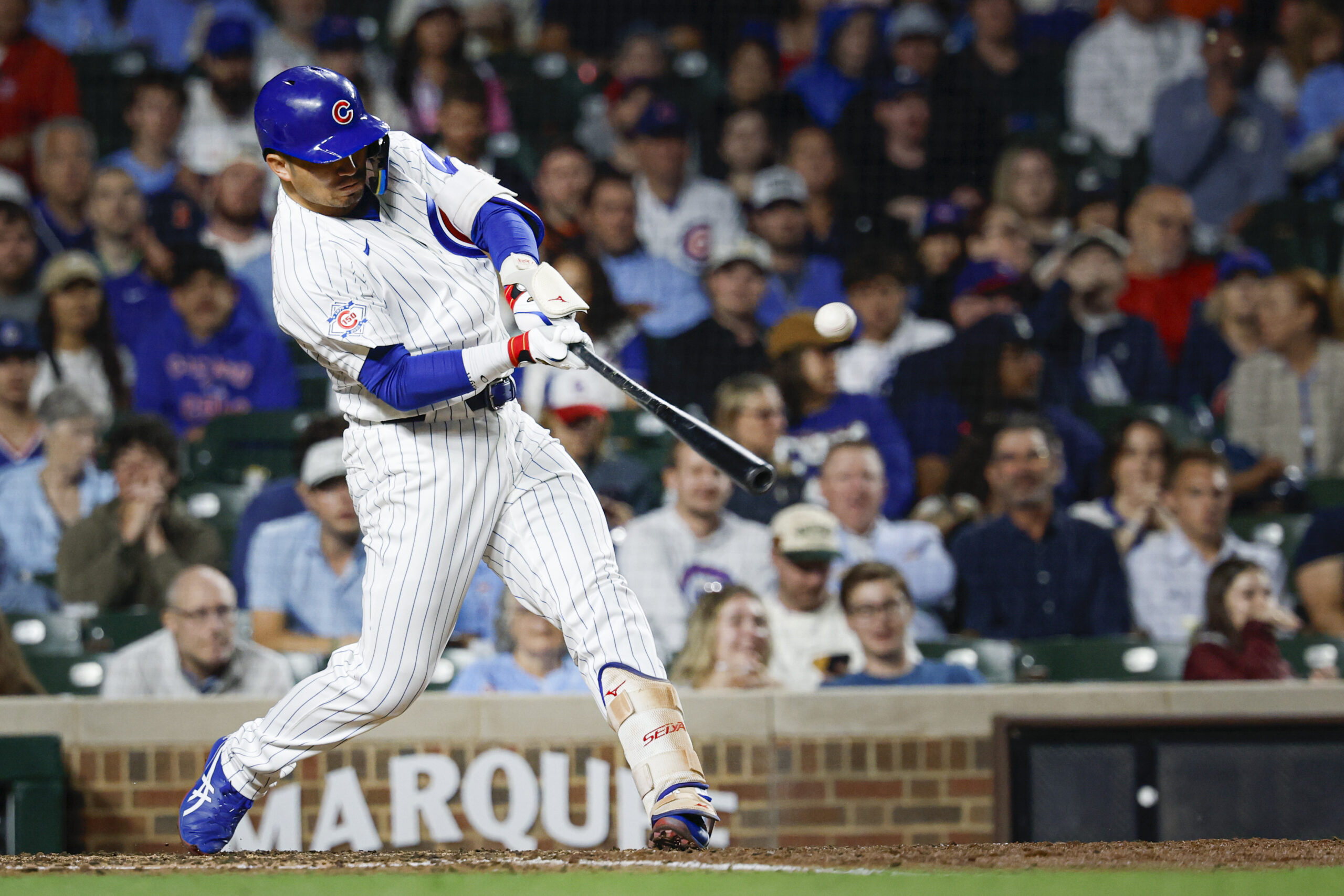 Jun 7, 2026; Chicago, Illinois, USA; Chicago Cubs right fielder Seiya Suzuki (27) singles against the San Francisco Giants during the sixth inning at Wrigley Field. Mandatory Credit: Kamil Krzaczynski-Imagn Images