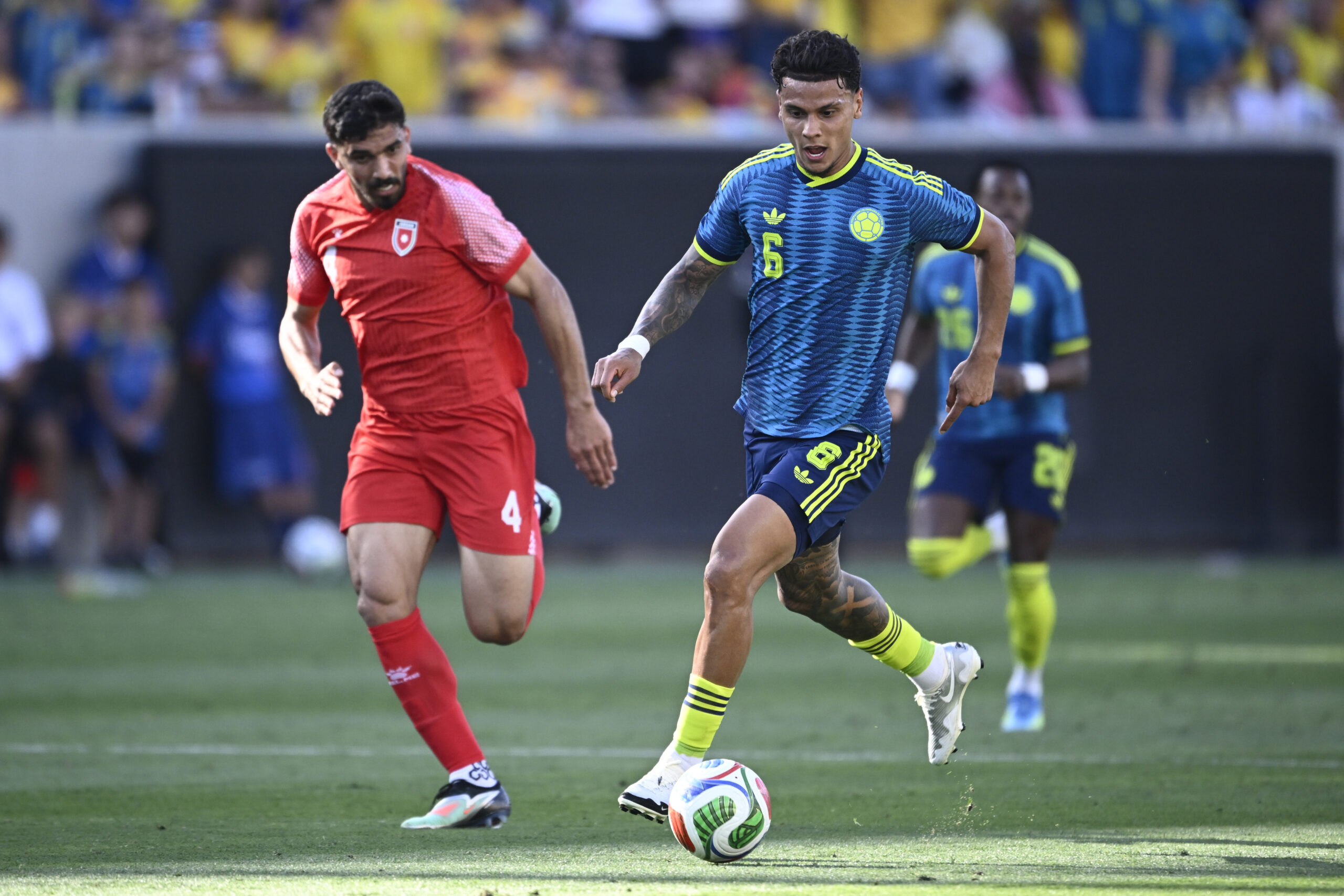 Jun 7, 2026; San Diego, California, USA; Colombia midfielder Richard Rios (6) and Jordan defender Husam Abu Dahab (4) race for the ball during the second half of a Road to 26 men's international friendly at Snapdragon Stadium. Mandatory Credit: Denis Poroy-Imagn Images