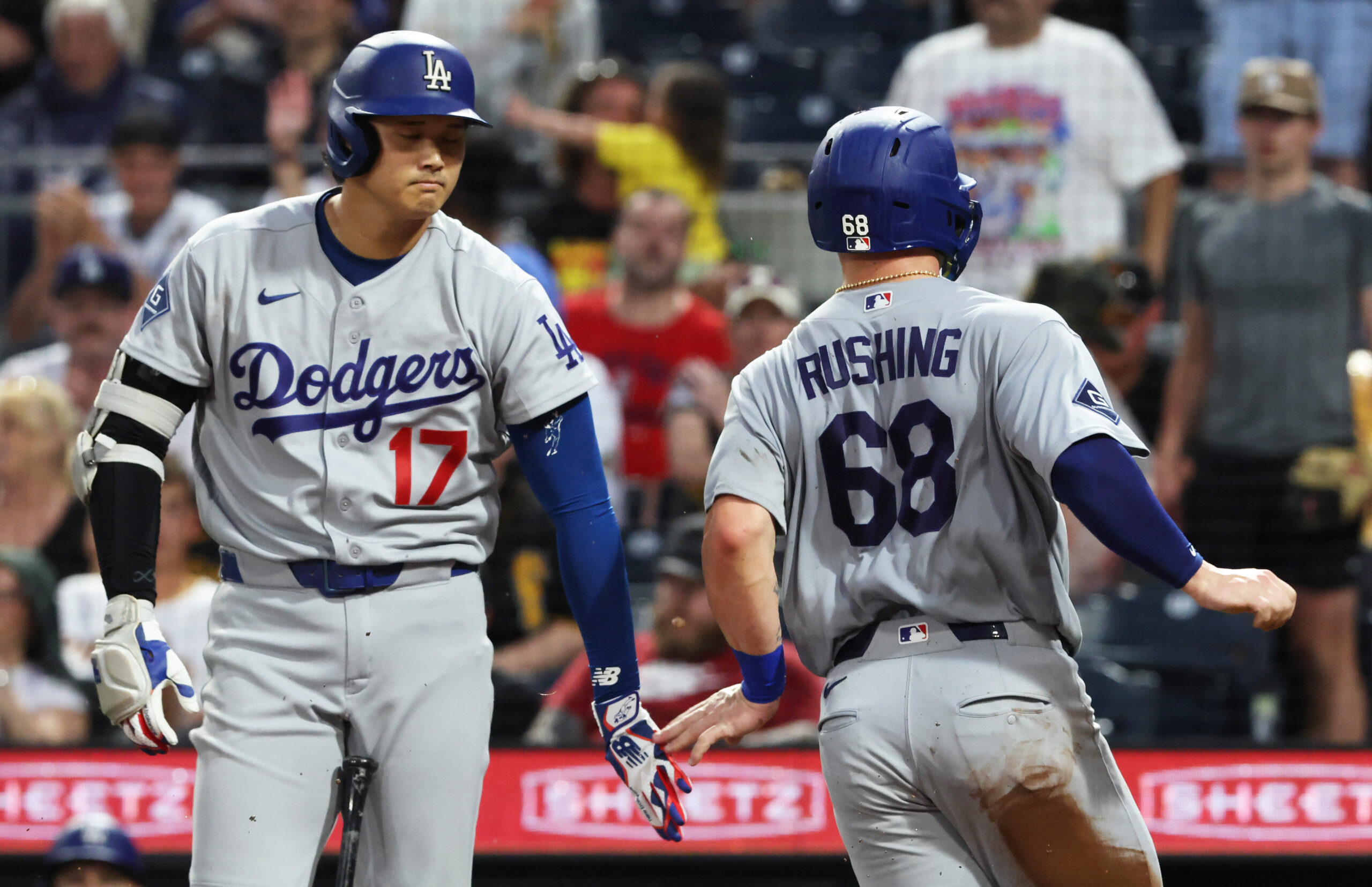 Jun 9, 2026; Pittsburgh, Pennsylvania, USA; Los Angeles Dodgers designated hitter Shohei Ohtani (17) greets catcher Dalton Rushing (68) crossing home plate to score a run against the Pittsburgh Pirates during the seventh inning at PNC Park. Mandatory Credit: Charles LeClaire-Imagn Images