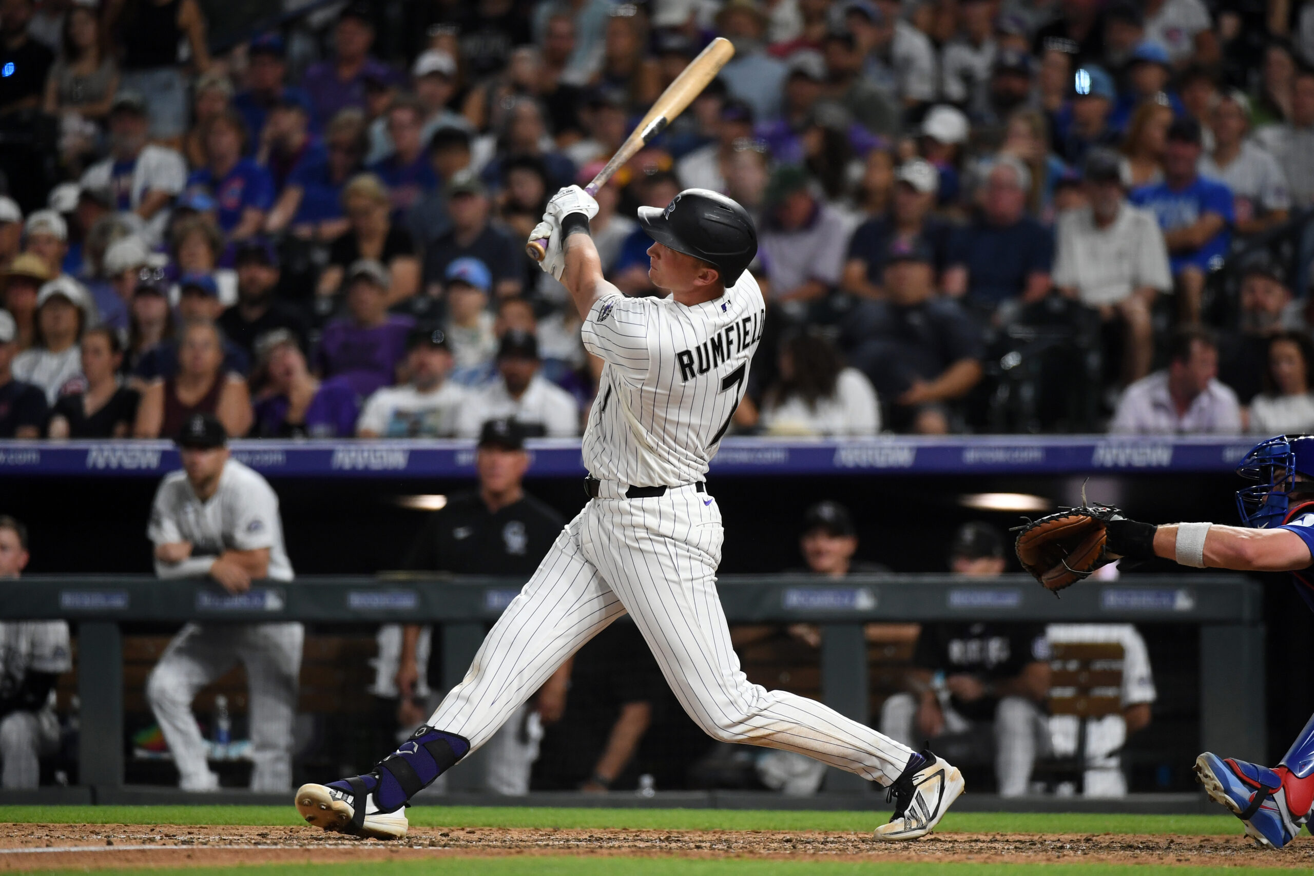 Jun 10, 2026; Denver, Colorado, USA; Colorado Rockies infielder TJ Rumfield (7) hits a home run to take the lead in the eighth inning against the Chicago Cubs at Coors Field. Mandatory Credit: Christopher Hanewinckel-Imagn Images