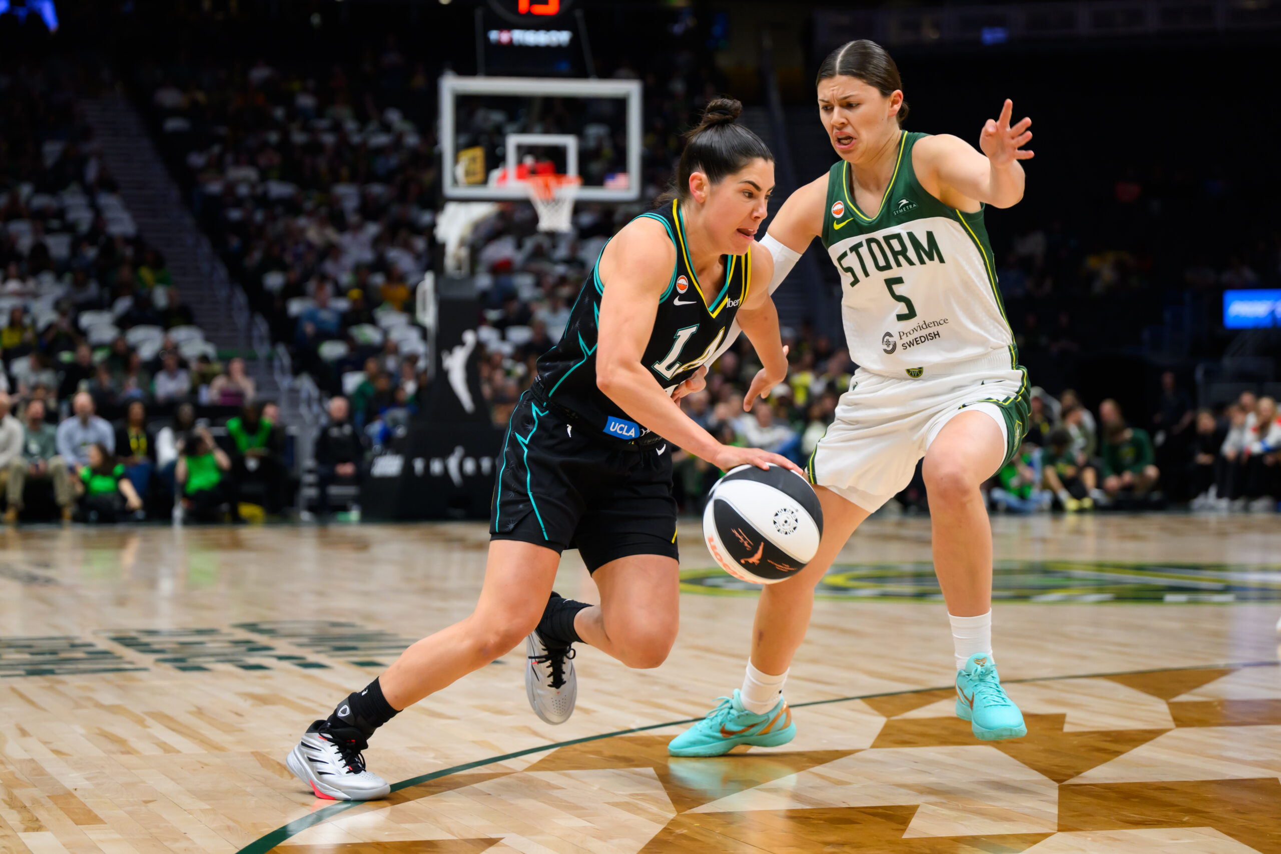 Jun 10, 2026; Seattle, Washington, USA; Seattle Storm guard Jade Melbourne (5) guards Los Angeles Sparks guard Kelsey Plum (10) during the first half at Climate Pledge Arena. Mandatory Credit: Steven Bisig-Imagn Images