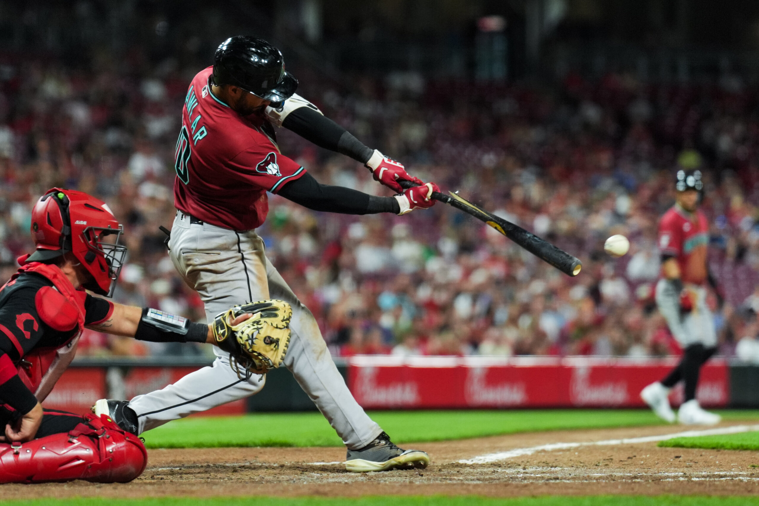 Jun 12, 2026; Cincinnati, Ohio, USA; Arizona Diamondbacks outfielder Jordan Lawlar (10) breaks his bat as he hits a two-run single against the Cincinnati Reds in the ninth inning at Great American Ball Park. Mandatory Credit: Aaron Doster-Imagn Images