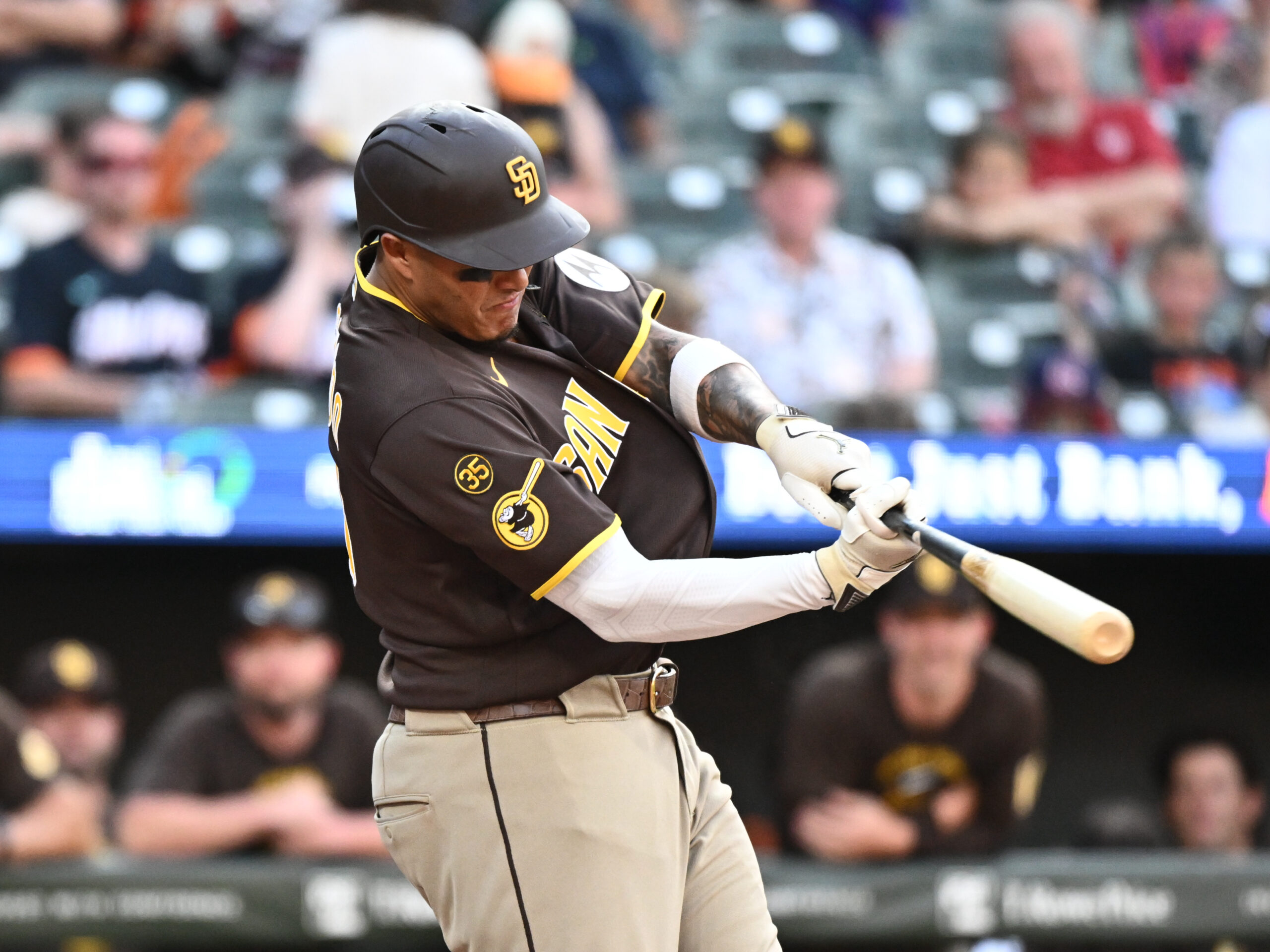 Jun 13, 2026; Baltimore, Maryland, USA; San Diego Padres third baseman Manny Machado (13) hits a solo home run during the ninth inning against the Baltimore Orioles at Oriole Park at Camden Yards. Mandatory Credit: James A. Pittman-Imagn Images