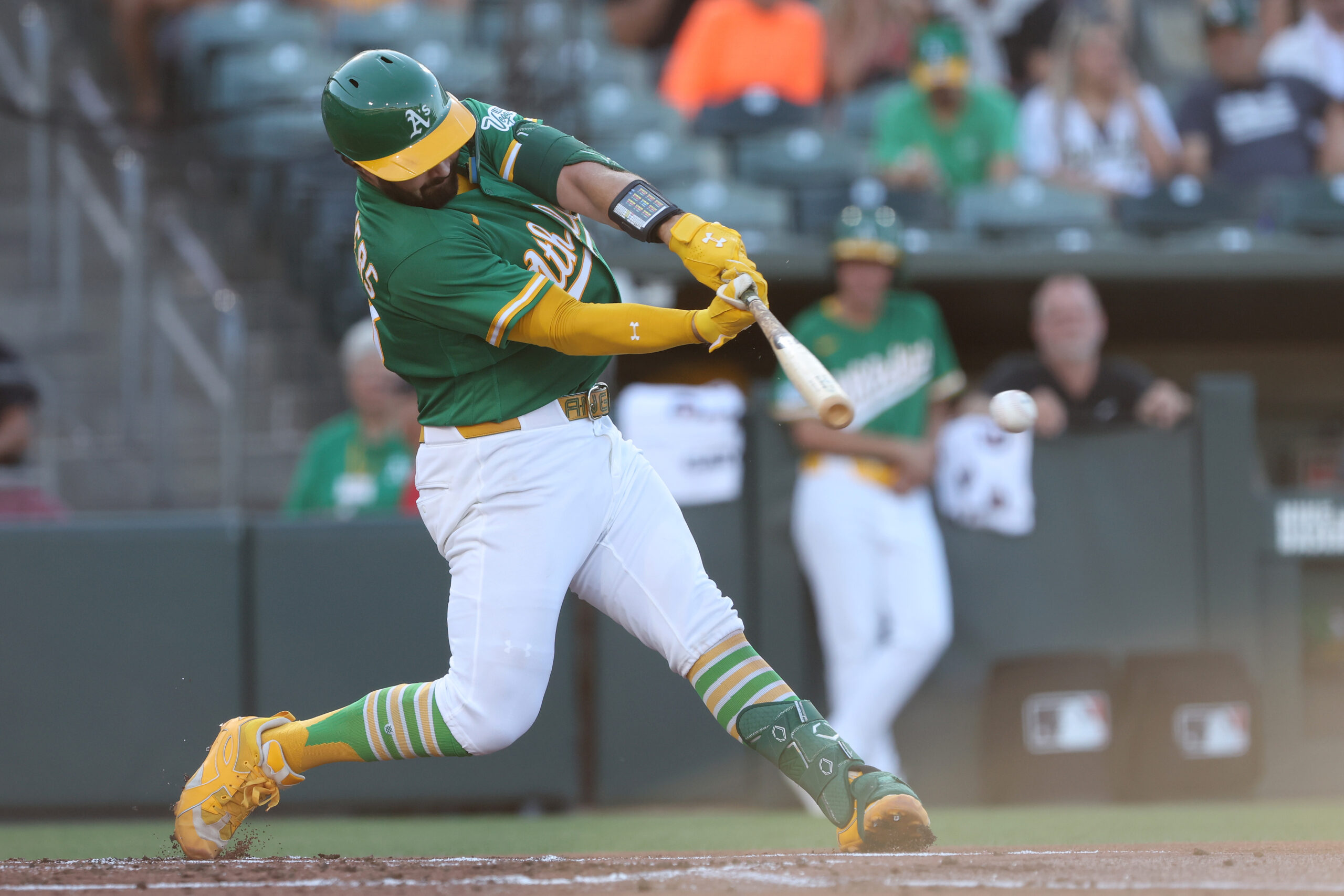Jun 15, 2026; West Sacramento, California, USA; Athletics catcher Shea Langeliers (23) hits a single against the Pittsburgh Pirates during the first inning at Sutter Health Park. Mandatory Credit: Dennis Lee-Imagn Images