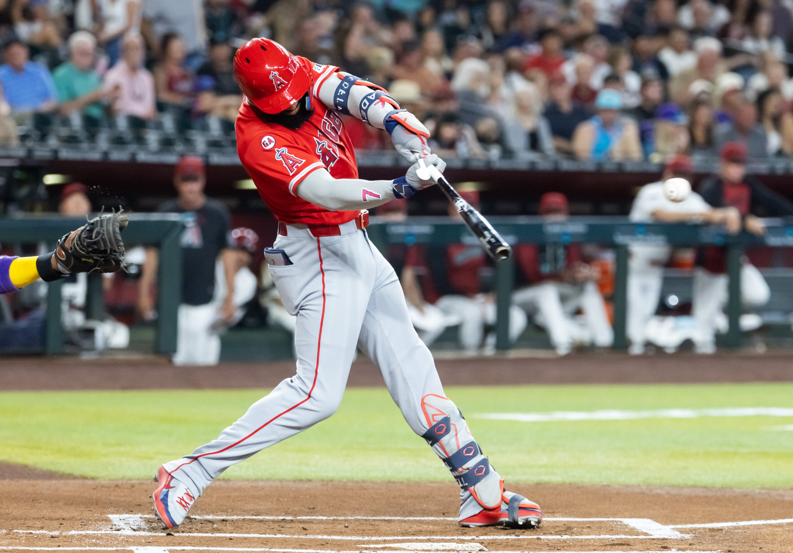Jun 15, 2026; Phoenix, Arizona, USA; Los Angeles Angels outfielder Jo Adell hits an RBI double in the first inning against the Arizona Diamondbacks at Chase Field. Mandatory Credit: Mark J. Rebilas-Imagn Images
