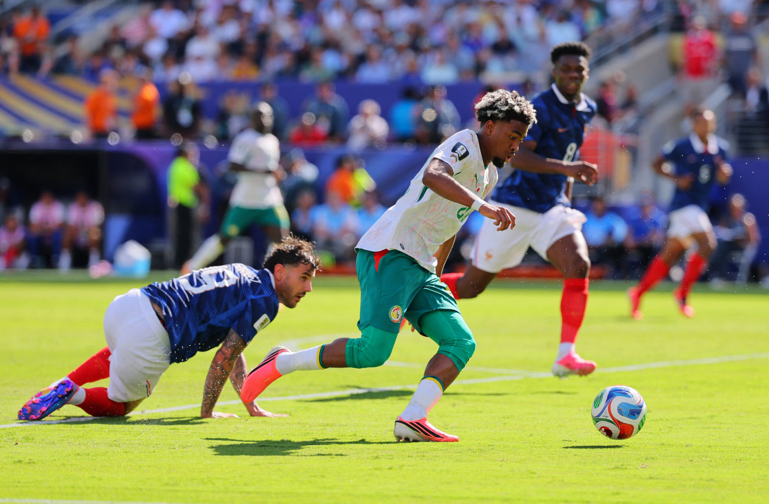 June 16, 2026; East Rutherford, New Jersey, U.S.; Senegal's Ibrahim Mbaye scores their first goal in action with France's Theo Hernandez.  Mandatory Credit: Caean Couto-Imagn Images