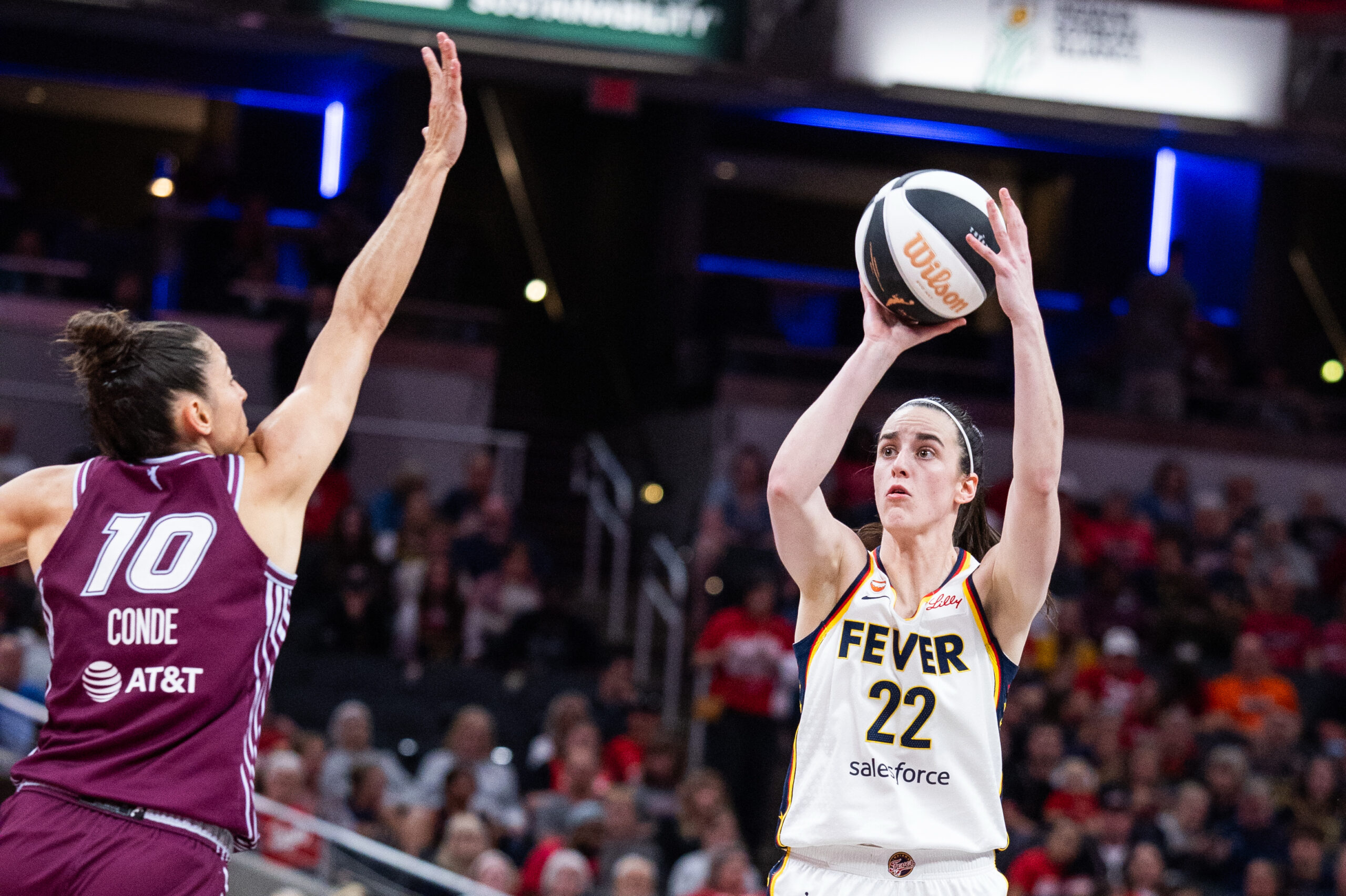 Jun 16, 2026; Indianapolis, Indiana, USA; Indiana Fever guard Caitlin Clark (22) shoots the ball while Toronto Tempo forward Maria Conde (10) defends in the second half at Gainbridge Fieldhouse. Mandatory Credit: Trevor Ruszkowski-Imagn Images