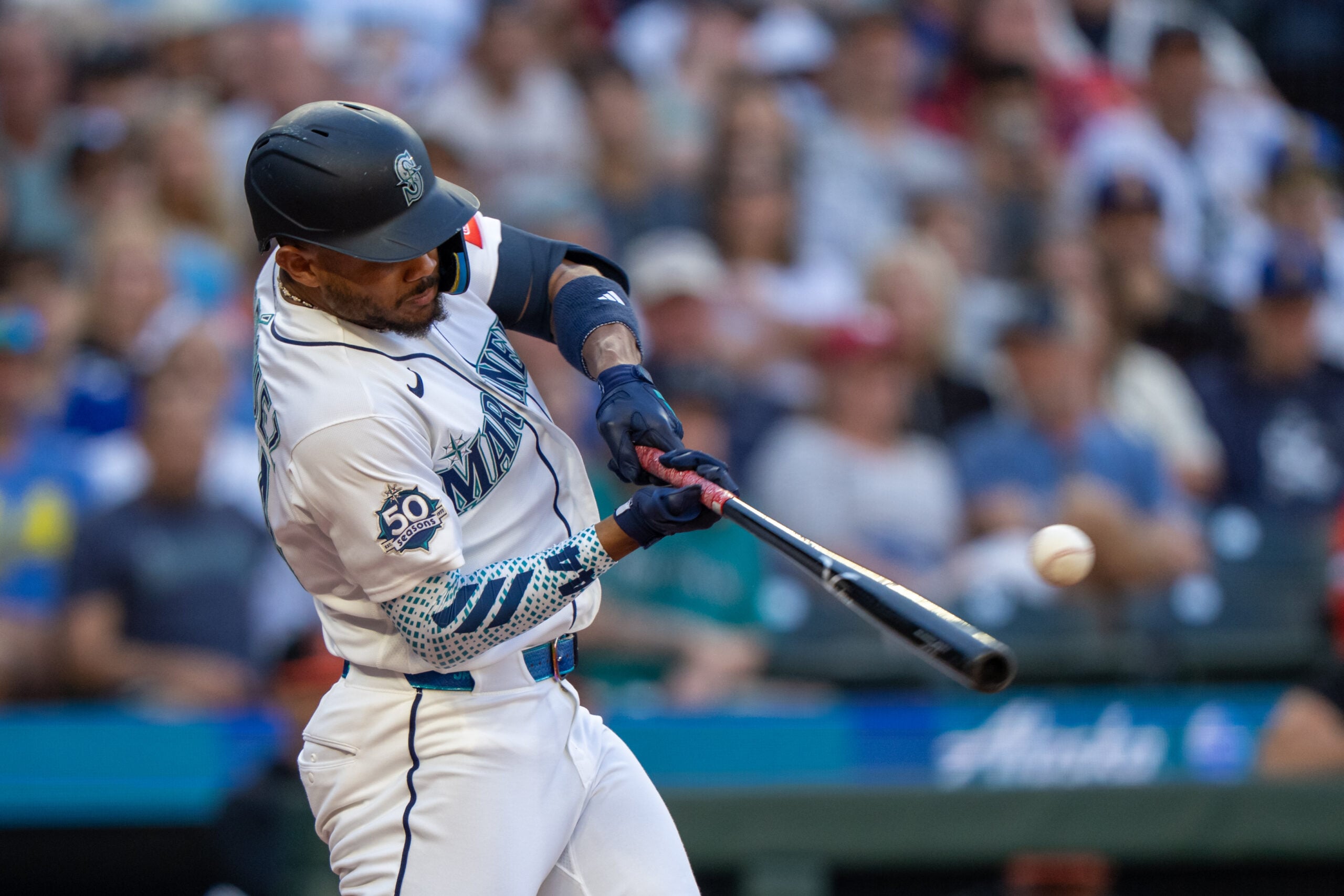 Jun 16, 2026; Seattle, Washington, USA; Seattle Mariners centerfielder Julio Rodriguez (44) hits a RBI-single during the third inning against the Baltimore Orioles at T-Mobile Park. Mandatory Credit: Stephen Brashear-Imagn Images