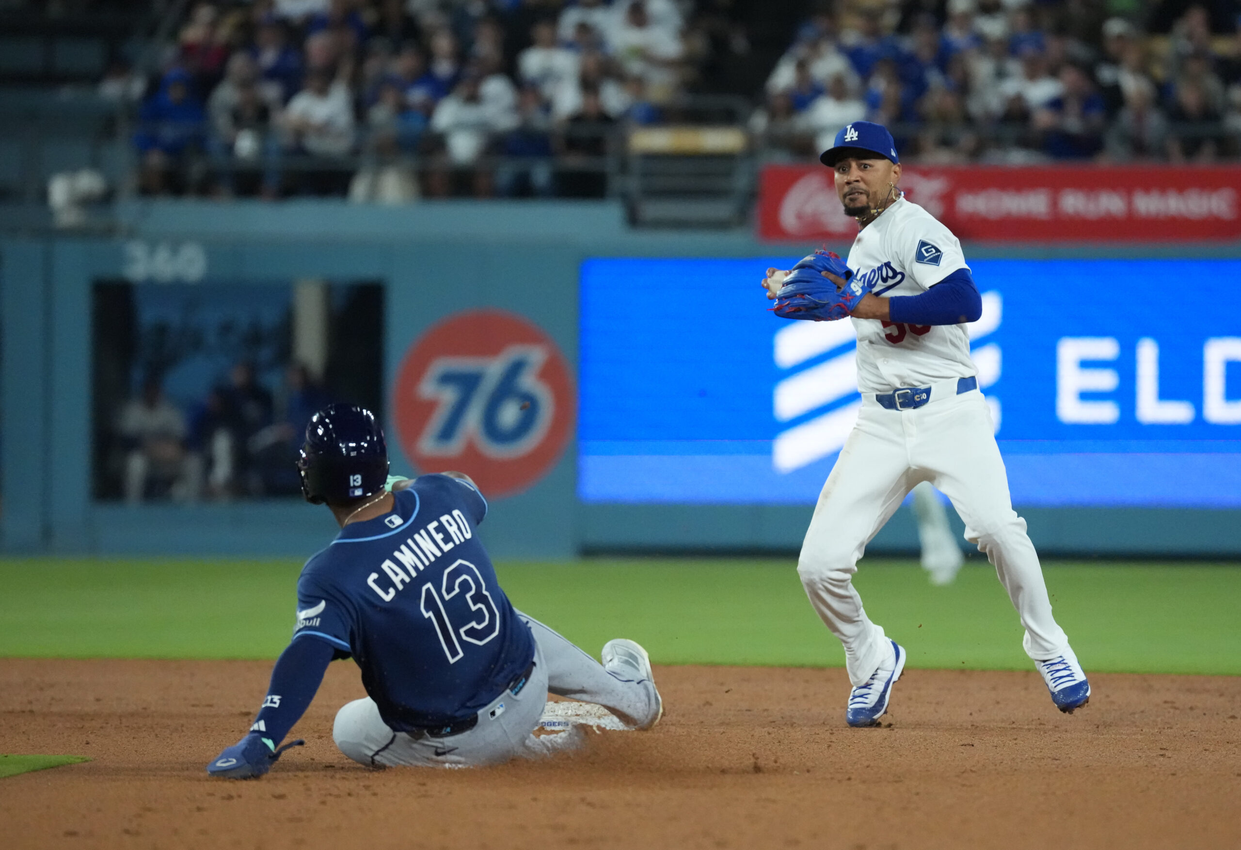 Jun 16, 2026; Los Angeles, California, USA;  Los Angeles Dodgers shortstop Mookie Betts (50) forces out Tampa Bay Rays third baseman Junior Caminero (13) during the seventh inning at Dodger Stadium. Mandatory Credit: Kirby Lee-Imagn Images