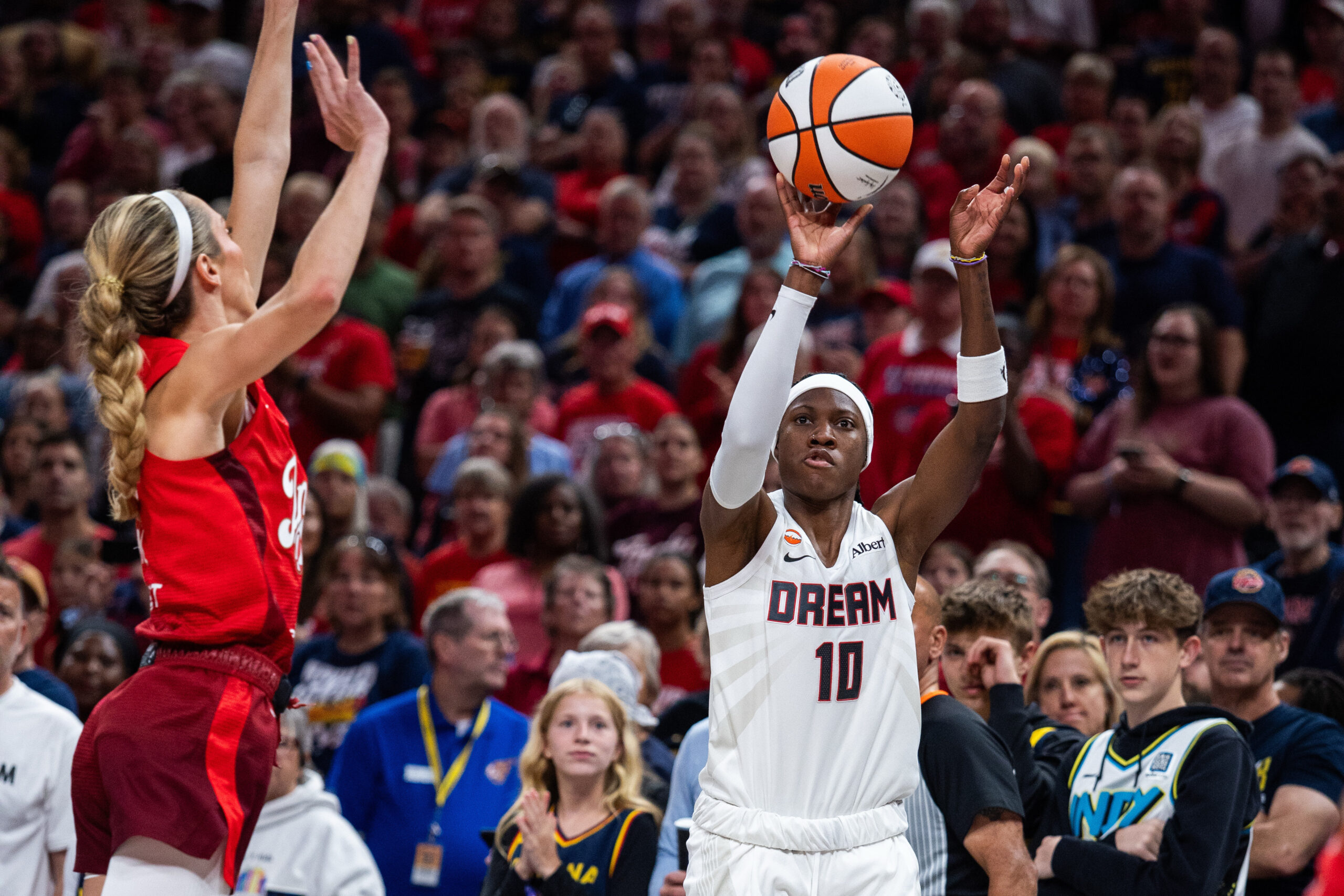 Jun 18, 2026; Indianapolis, Indiana, USA; Atlanta Dream guard Rhyne Howard (10) shoots against Indiana Fever guard Lexie Hull (10) in the first half at Gainbridge Fieldhouse. Mandatory Credit: Trevor Ruszkowski-Imagn Images