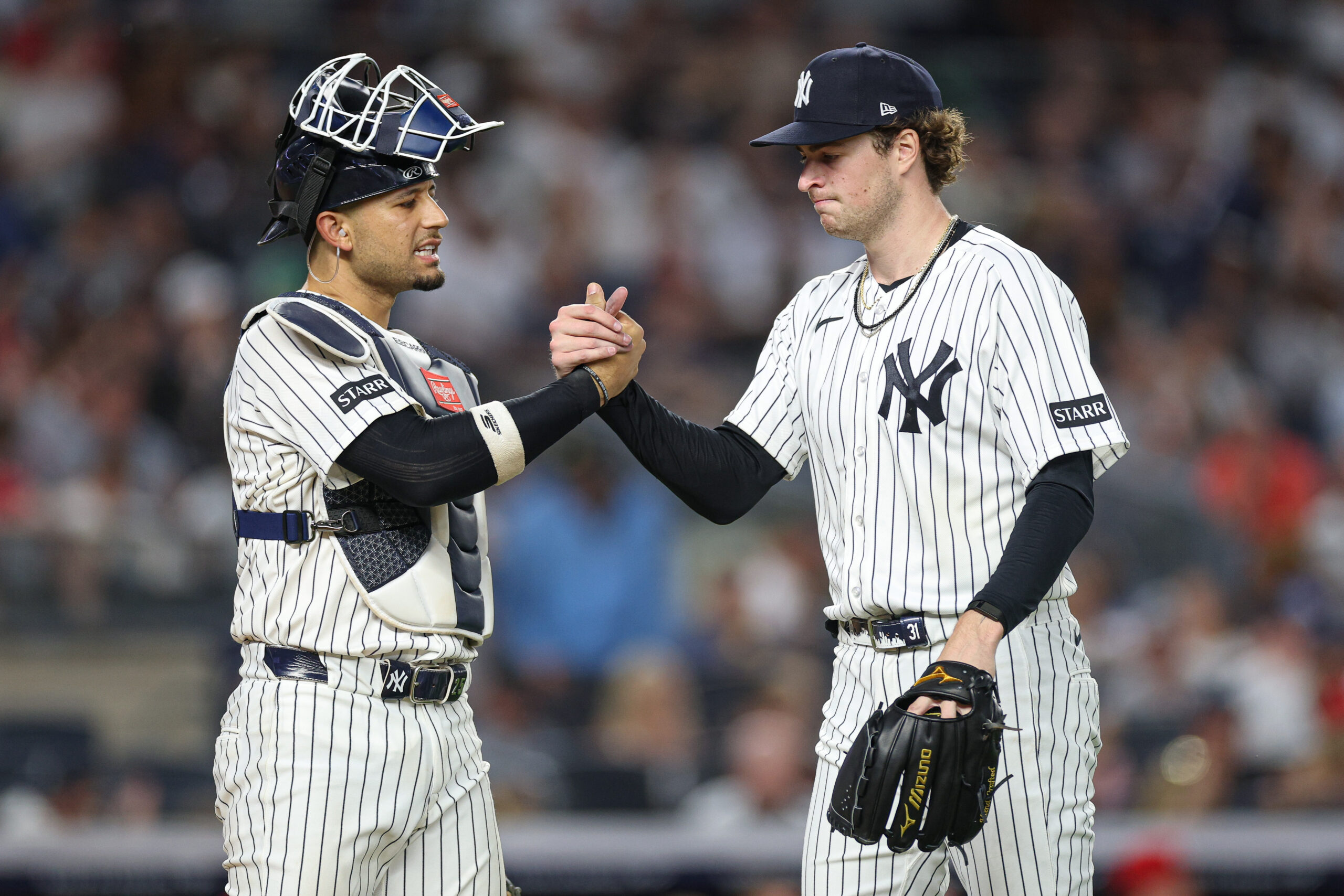 Jun 19, 2026; Bronx, New York, USA; New York Yankees pitcher Cam Schlittler (31) shakes hands with catcher J.C. Escarra (25) after the top of the sixth inning against the Cincinnati Reds at Yankee Stadium. Mandatory Credit: Vincent Carchietta-Imagn Images