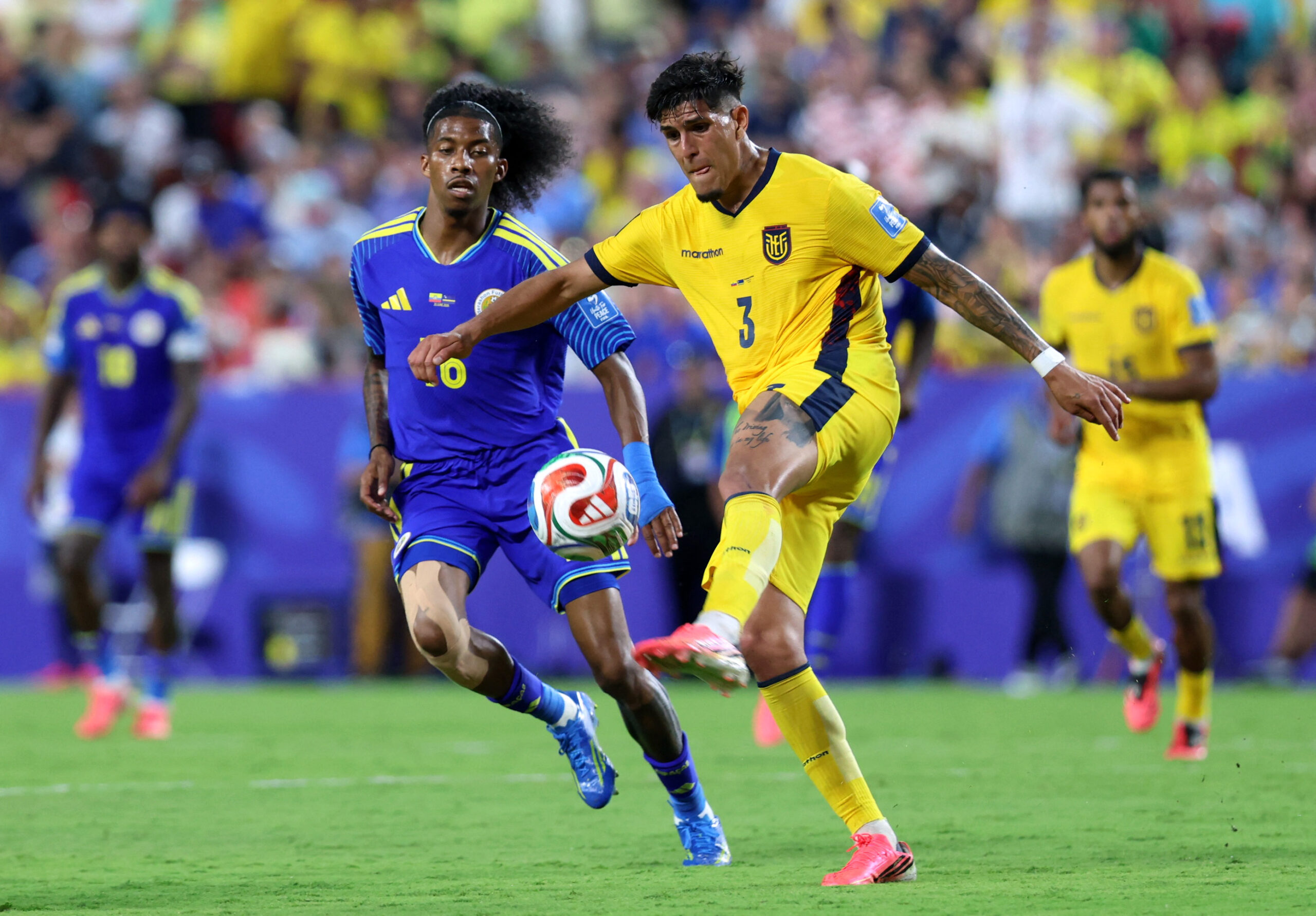 June 20, 2026; Kansas City, Missouri, U.S.; Ecuador defender Piero Hincapie (3) in action with Curacao forward Jearl Margaritha (16). Mandatory Credit: Kylie Graham-Imagn Images