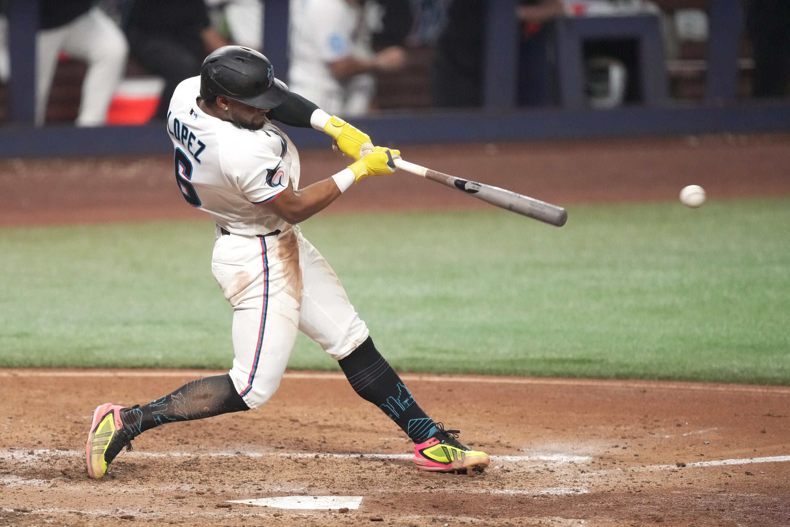 Jun 22, 2026; Miami, Florida, USA;  Miami Marlins shortstop Otto Lopez (6) hits a double in the sixth inning against the Texas Rangers at loanDepot Park. Mandatory Credit: Jim Rassol-Imagn Images