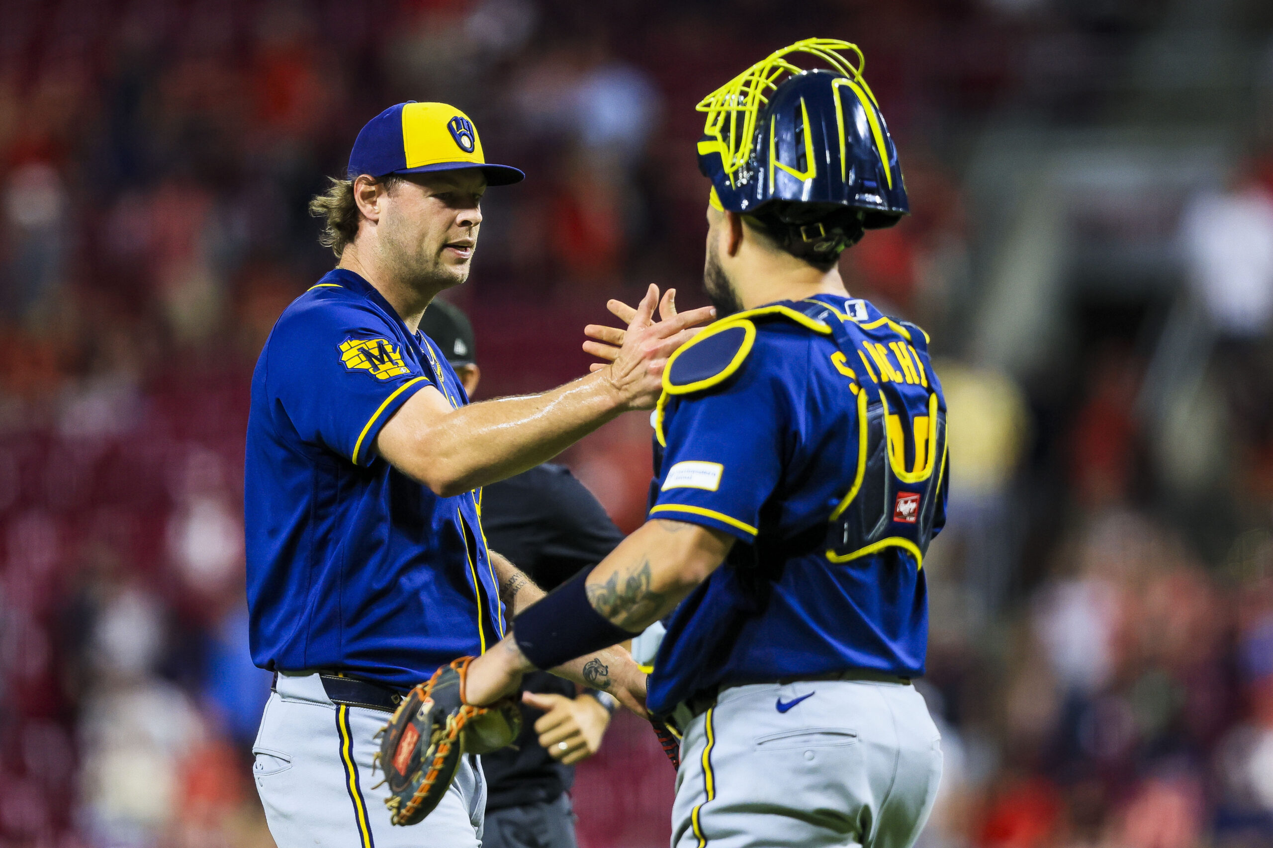 Jun 23, 2026; Cincinnati, Ohio, USA; Milwaukee Brewers relief pitcher Trevor Megill (29) shakes hands with catcher Gary Sanchez (99) after the victory over the Cincinnati Reds at Great American Ball Park. Mandatory Credit: Katie Stratman-Imagn Images