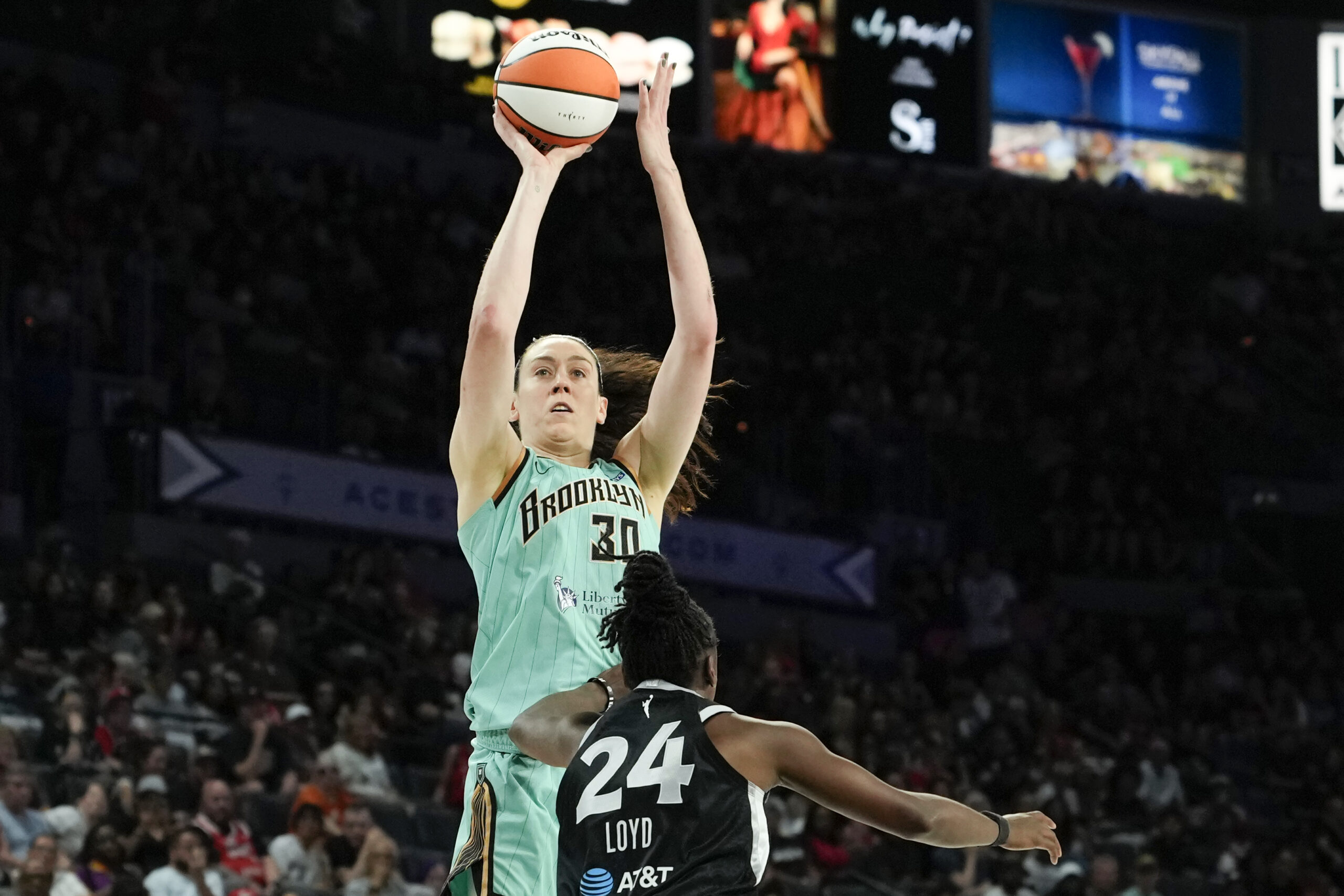 Jun 23, 2026; Las Vegas, Nevada, USA; New York Liberty forward Breanna Stewart (30) shoots the ball against Las Vegas Aces guard Jewell Loyd (24) during the fourth quarter of a WNBA basketball game at Michelob Ultra Arena. Mandatory Credit: Lucas Peltier-Imagn Images