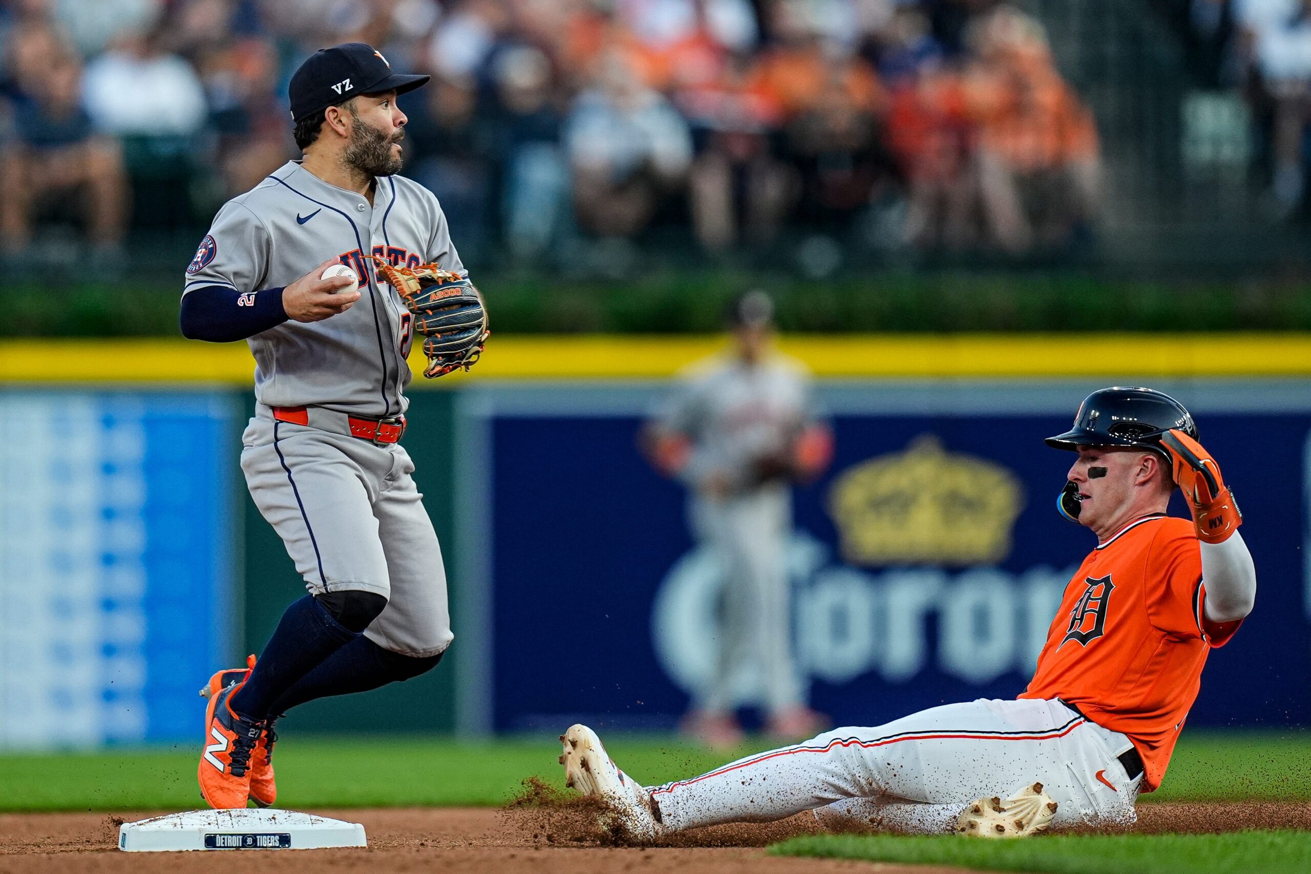 Detroit Tigers shortstop Kevin McGonigle (7) slides for second base against Houston Astros second baseman Jose Altuve (27) during the sixth inning at Comerica Park in Detroit on Friday, June 26, 2026.