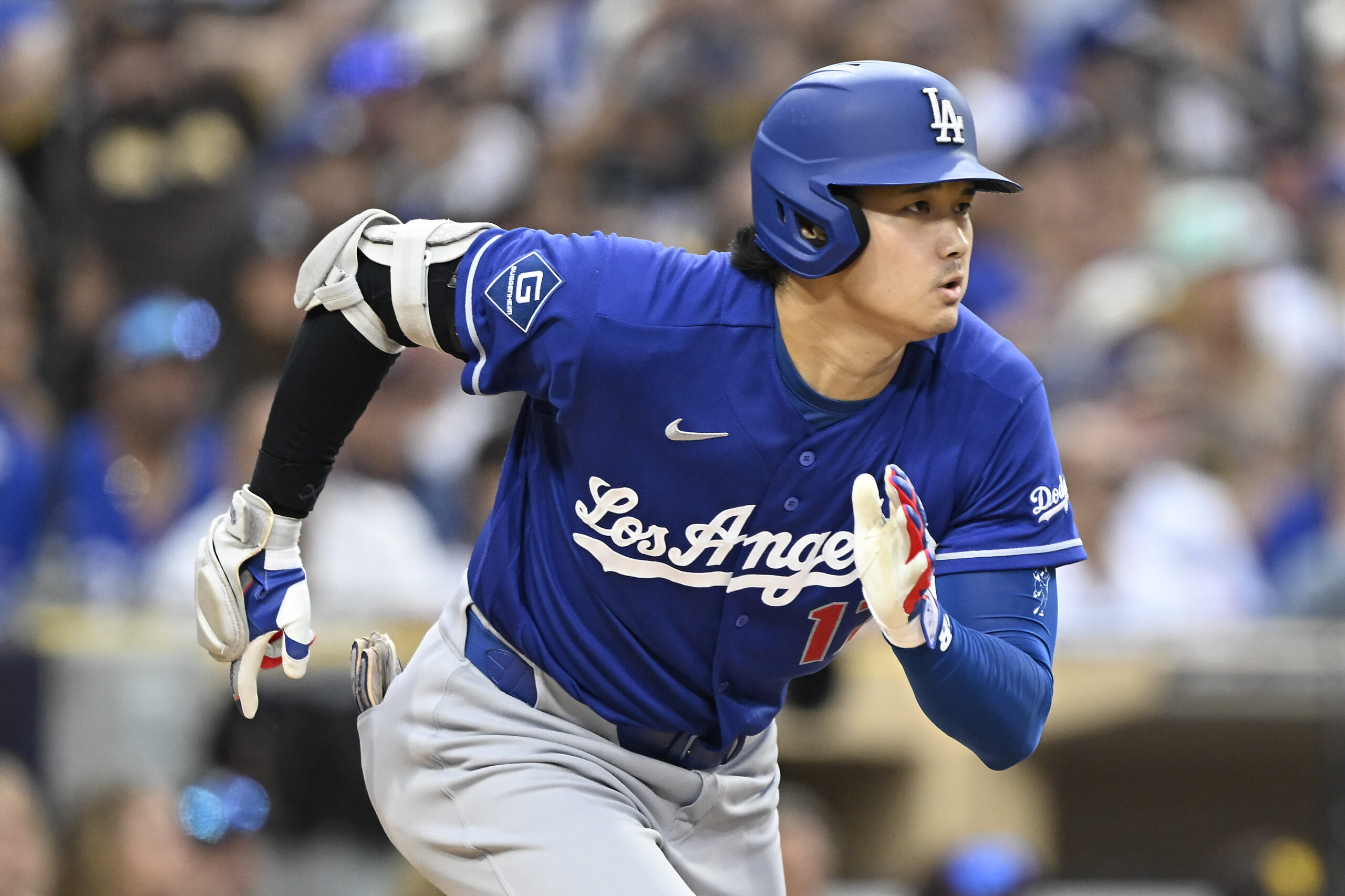 Jun 27, 2026; San Diego, California, USA; Los Angeles Dodgers designated hitter Shohei Ohtani (17) runs after hitting a single during the sixth inning against the San Diego Padres at Petco Park. Mandatory Credit: Denis Poroy-Imagn Images