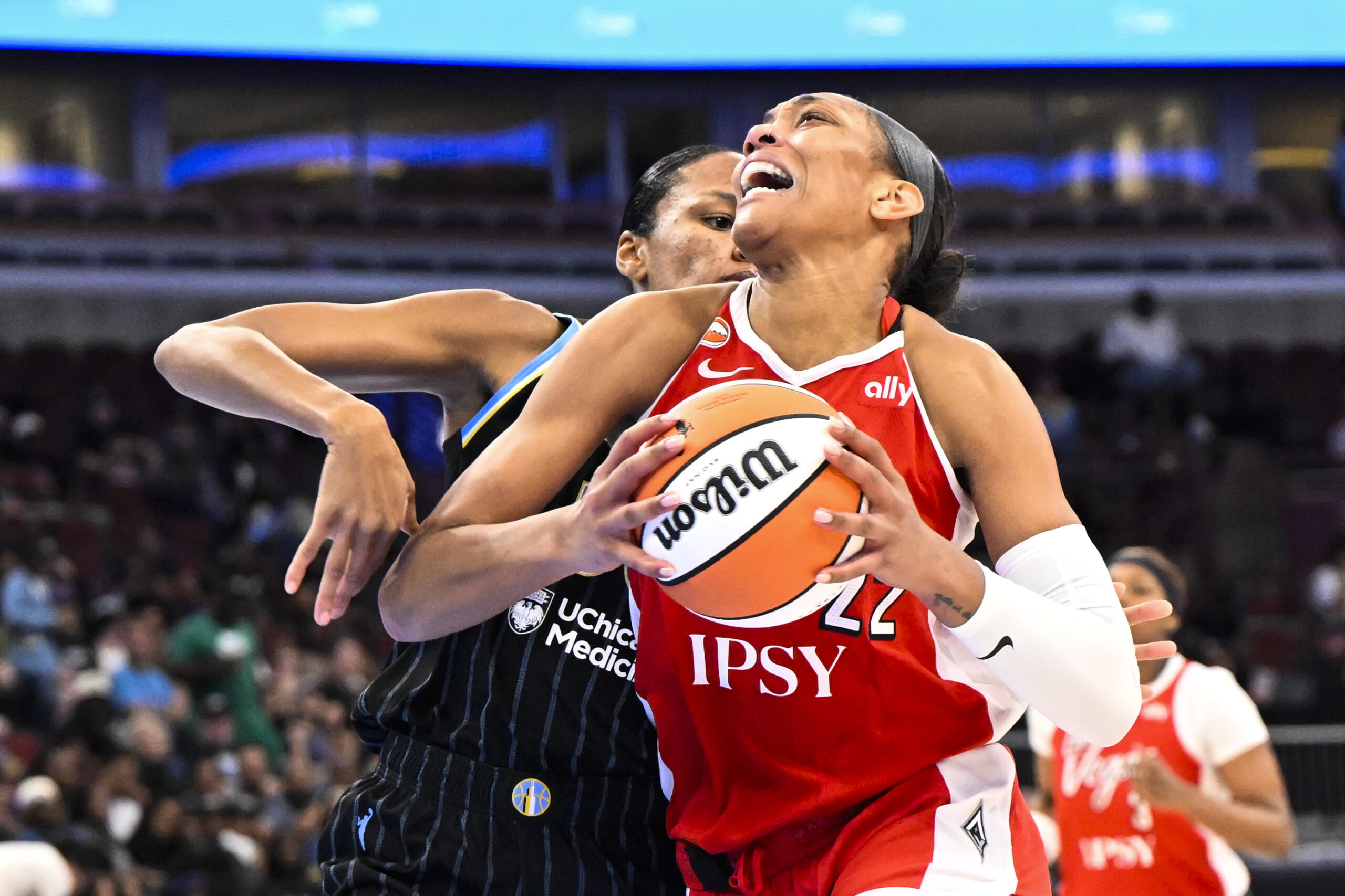 Jun 28, 2026; Chicago, Illinois, USA;  Las Vegas Aces center A'ja Wilson (22) drives to the basket against Chicago Sky forward-center  Azura Stevens (30) during the second half at United Center. Mandatory Credit: Matt Marton-Imagn Images