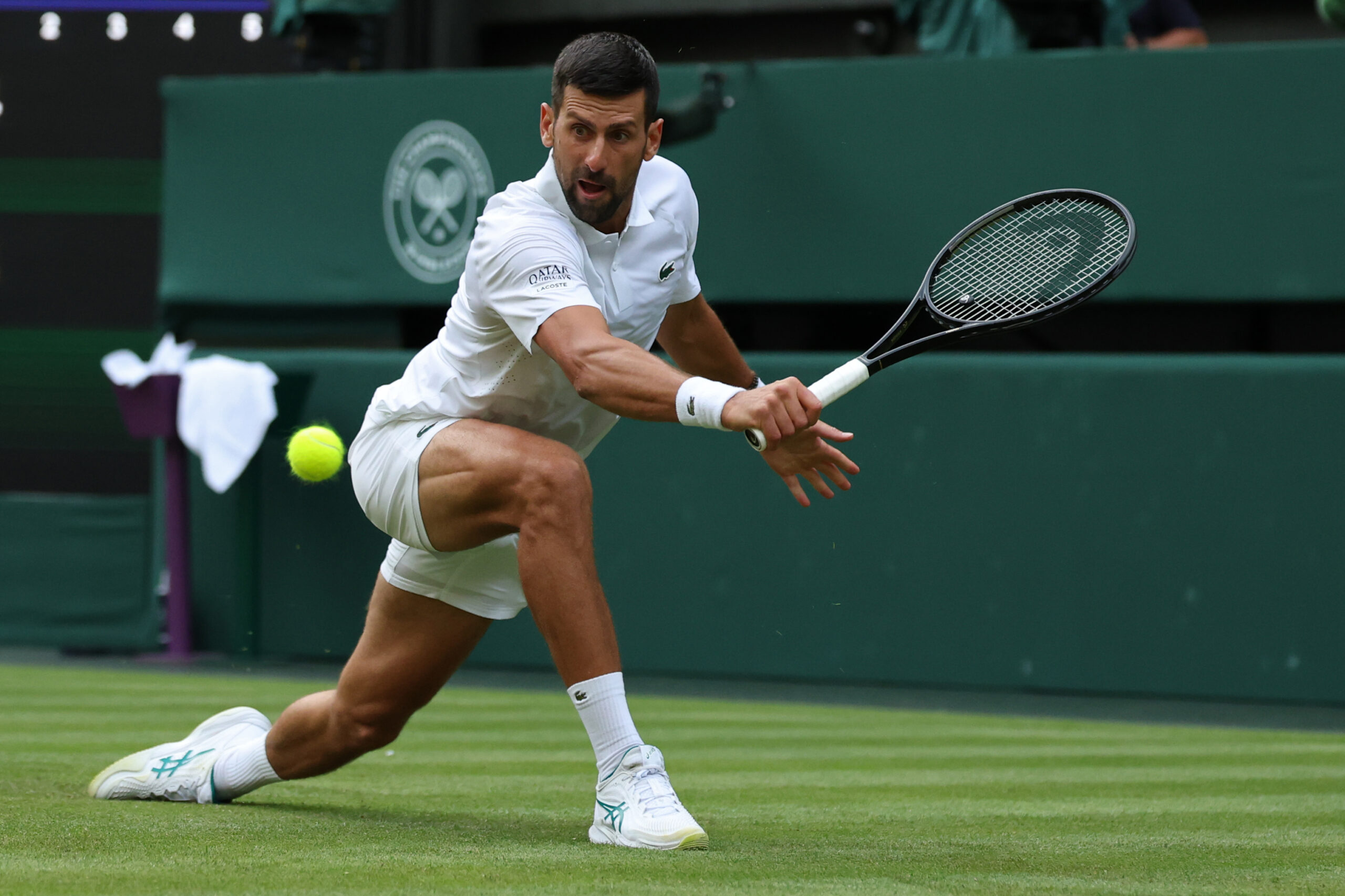 Jun 29, 2026; London, United Kingdom; Novak Djokovic (SRB) reaches for a backhand against Yibing Wu (CHN) (not pictured) on day one of The Championships Wimbledon 2026  at All England Lawn Tennis and Croquet Club. Mandatory Credit: Geoff Burke-Imagn Images