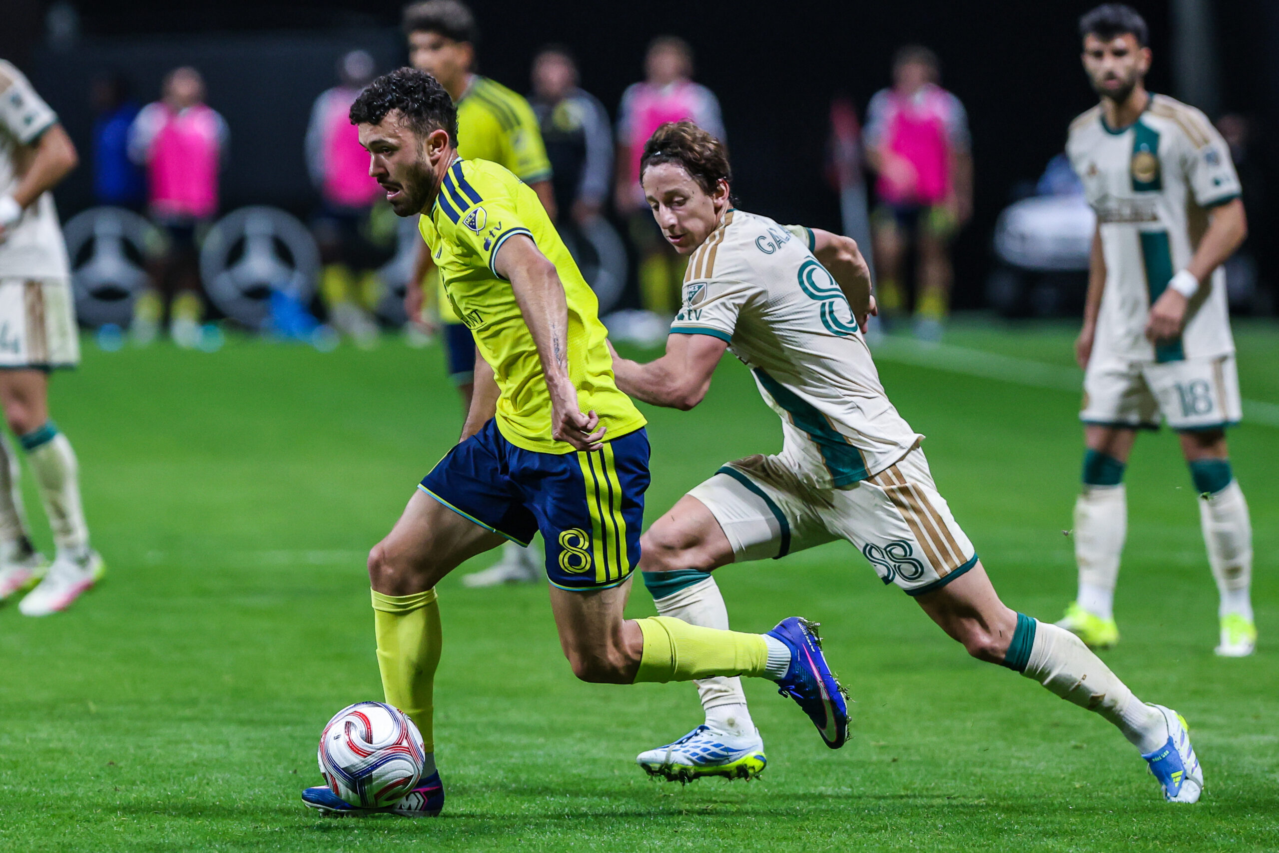Apr 18, 2026; Atlanta, Georgia, USA; Nashville SC midfielder Patrick Yazbek (8) dribbles the ball towards the goal against Atlanta United midfielder Matías Galarza (88) during the second half at Mercedes-Benz Stadium. Mandatory Credit: Jordan Godfree-Imagn Images