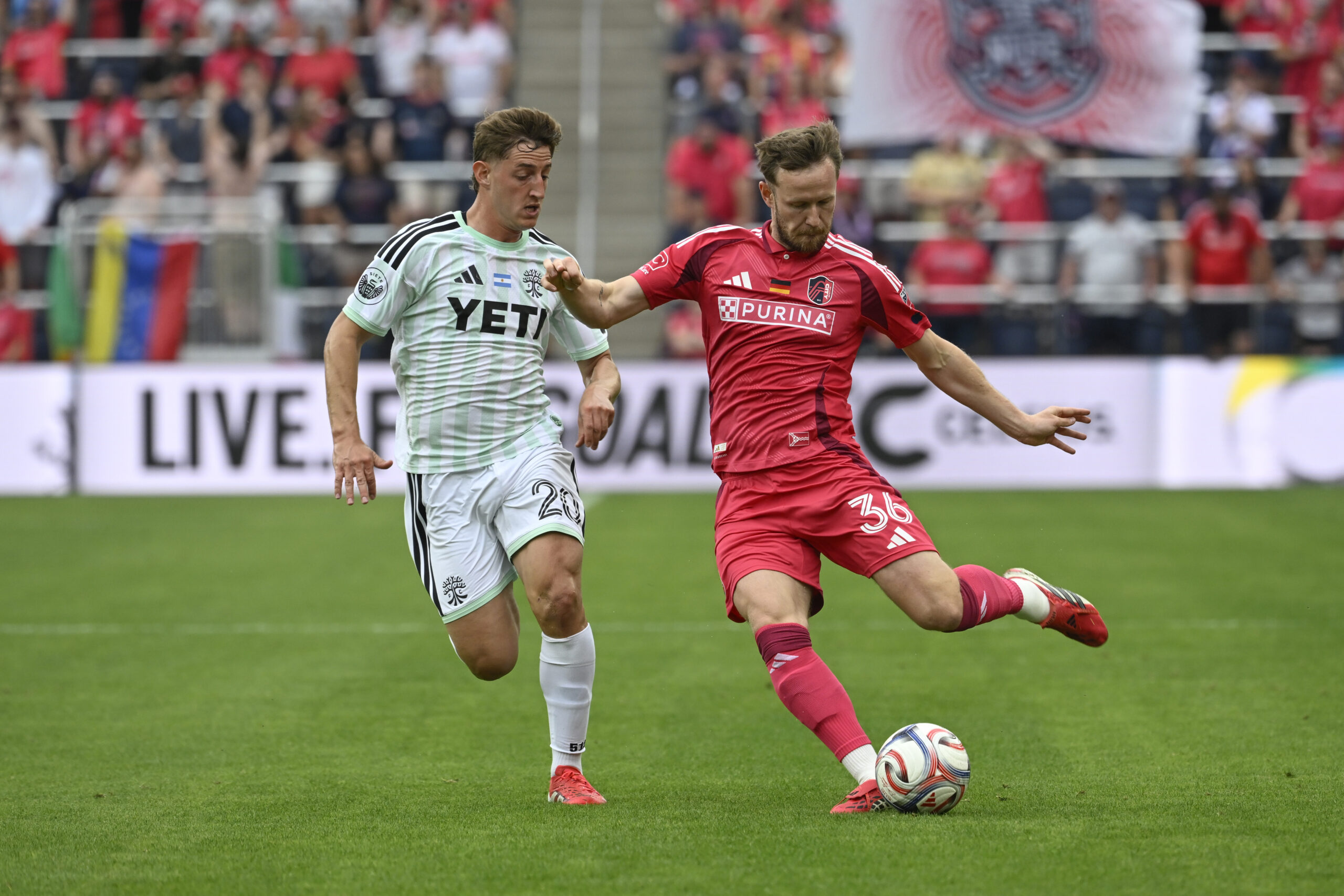 May 23, 2026; St. Louis, Missouri, USA; Austin FC midfielder Nicolas Dubersarsky (20) pressures St. Louis CITY SC forward Cedric Teuchert (36) in the second half at Energizer Park. Mandatory Credit: Joe Puetz-Imagn Images