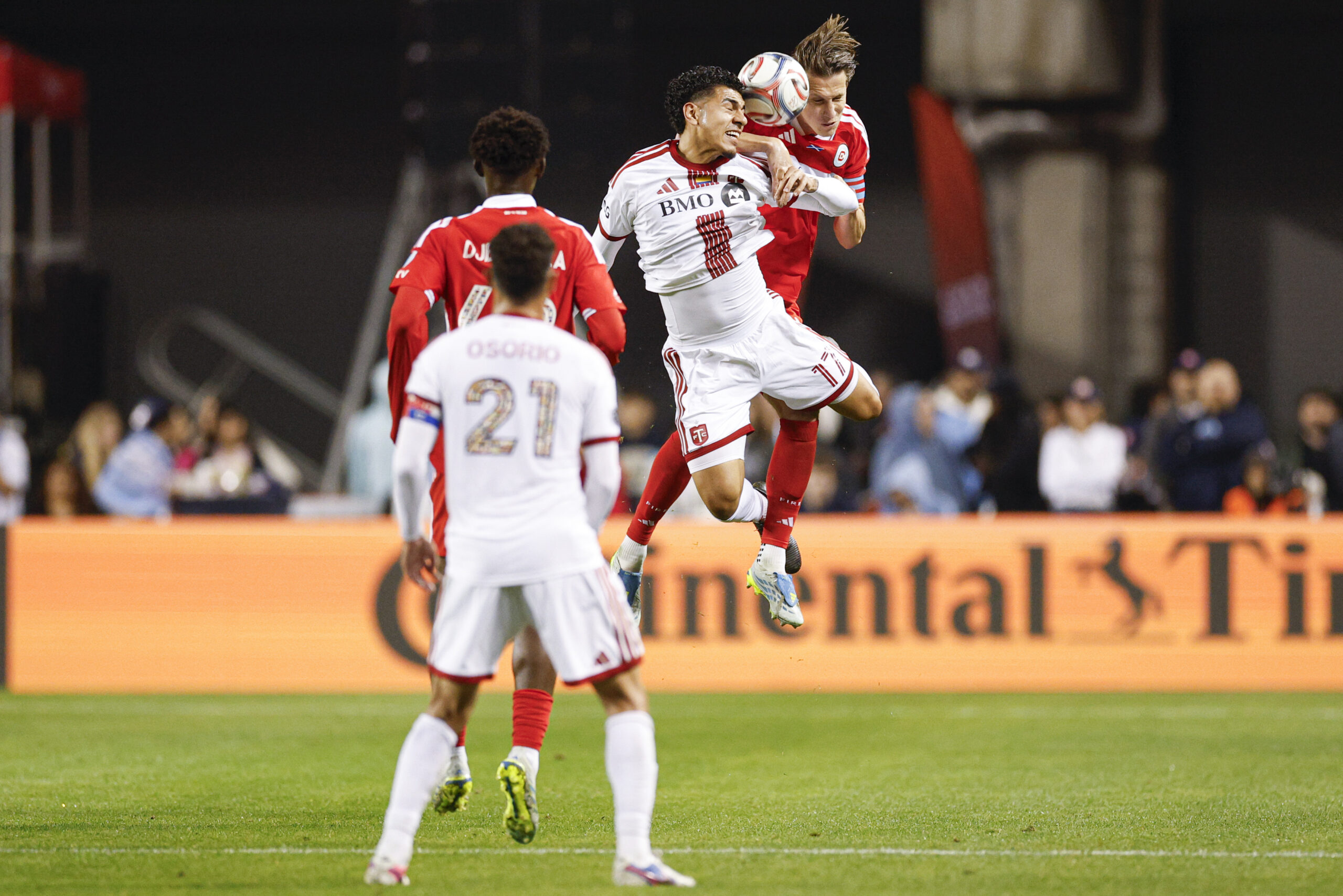 May 23, 2026; Chicago, Illinois, USA; Toronto FC forward Emilio Aristizábal (17) battles for the ball with Chicago Fire FC defender Jack Elliott (3) during the second half at Soldier Field. Mandatory Credit: Kamil Krzaczynski-Imagn Images