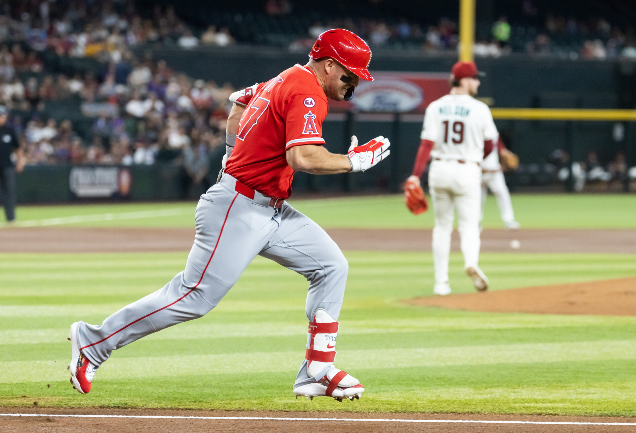 Jun 15, 2026; Phoenix, Arizona, USA; Los Angeles Angels outfielder Mike Trout runs to first base against the Arizona Diamondbacks at Chase Field. Mandatory Credit: Mark J. Rebilas-Imagn Images