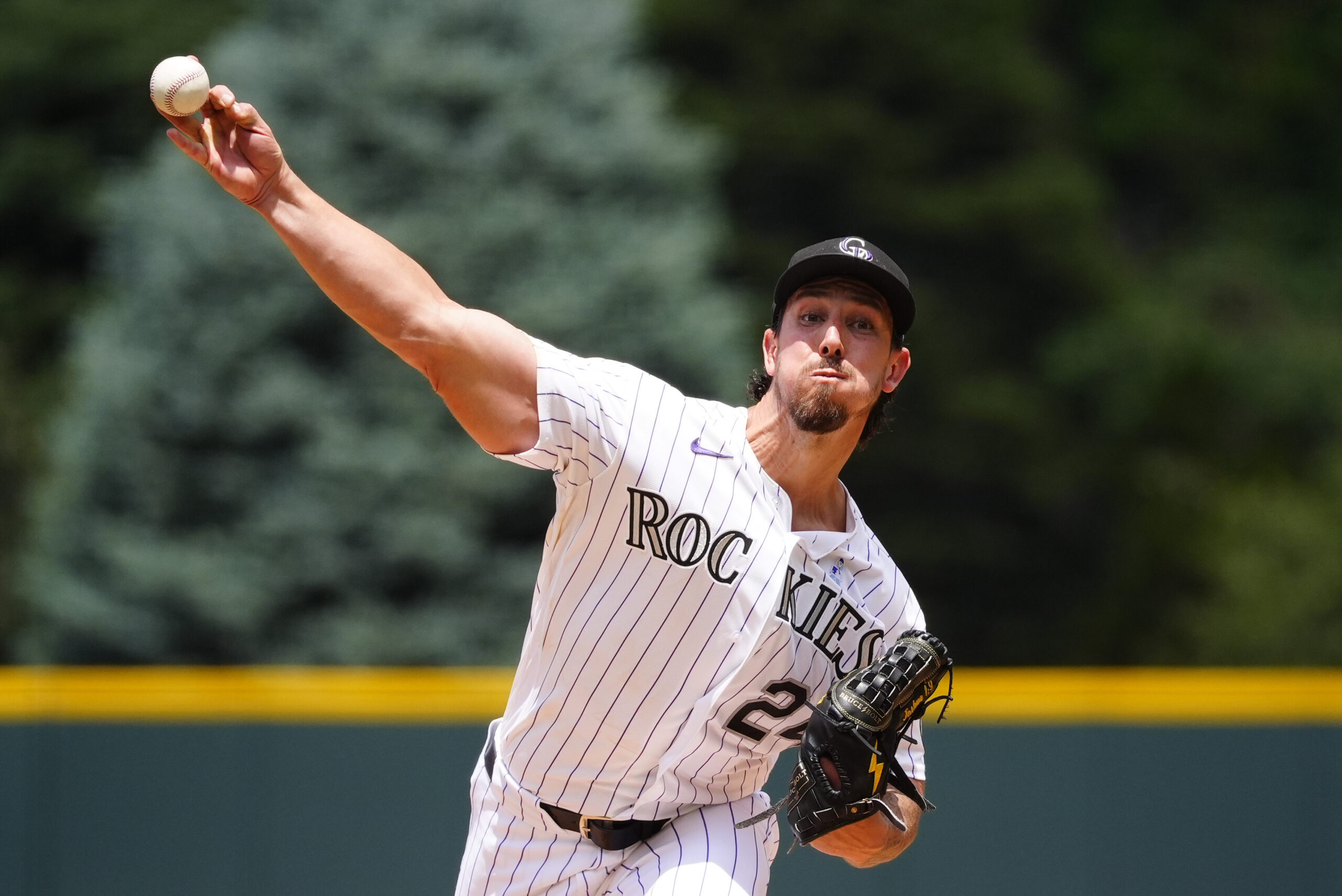 Jun 21, 2026; Denver, Colorado, USA; Colorado Rockies starting pitcher Michael Lorenzen (24) delivers a pitch in the first inning against the Pittsburgh Pirates at Coors Field. Mandatory Credit: Ron Chenoy-Imagn Images