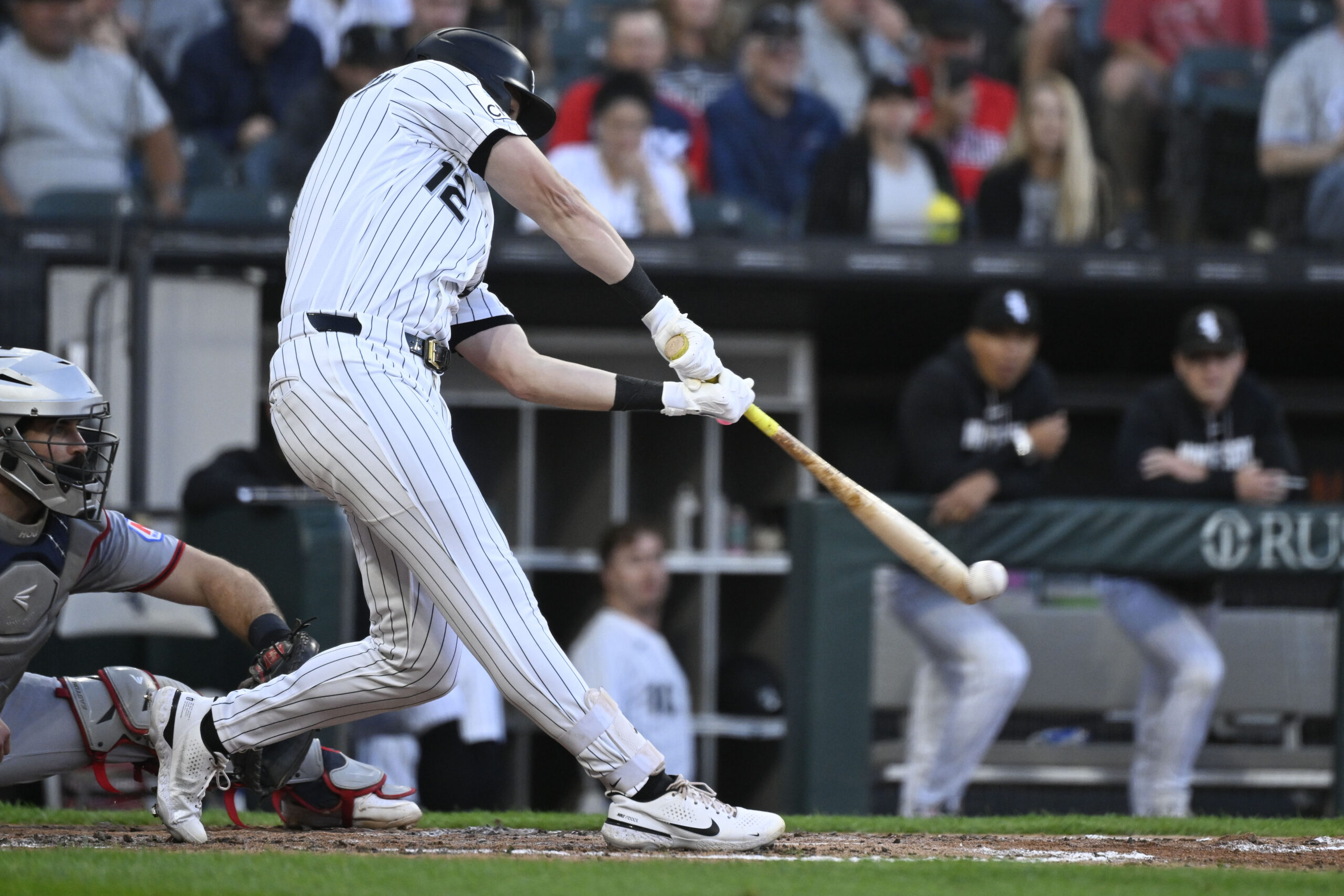 Jun 23, 2026; Chicago, Illinois, USA;  Chicago White Sox shortstop Colson Montgomery (12) hits an RBI single during the fourth inning against the Cleveland Guardians at Rate Field. Mandatory Credit: Matt Marton-Imagn Images