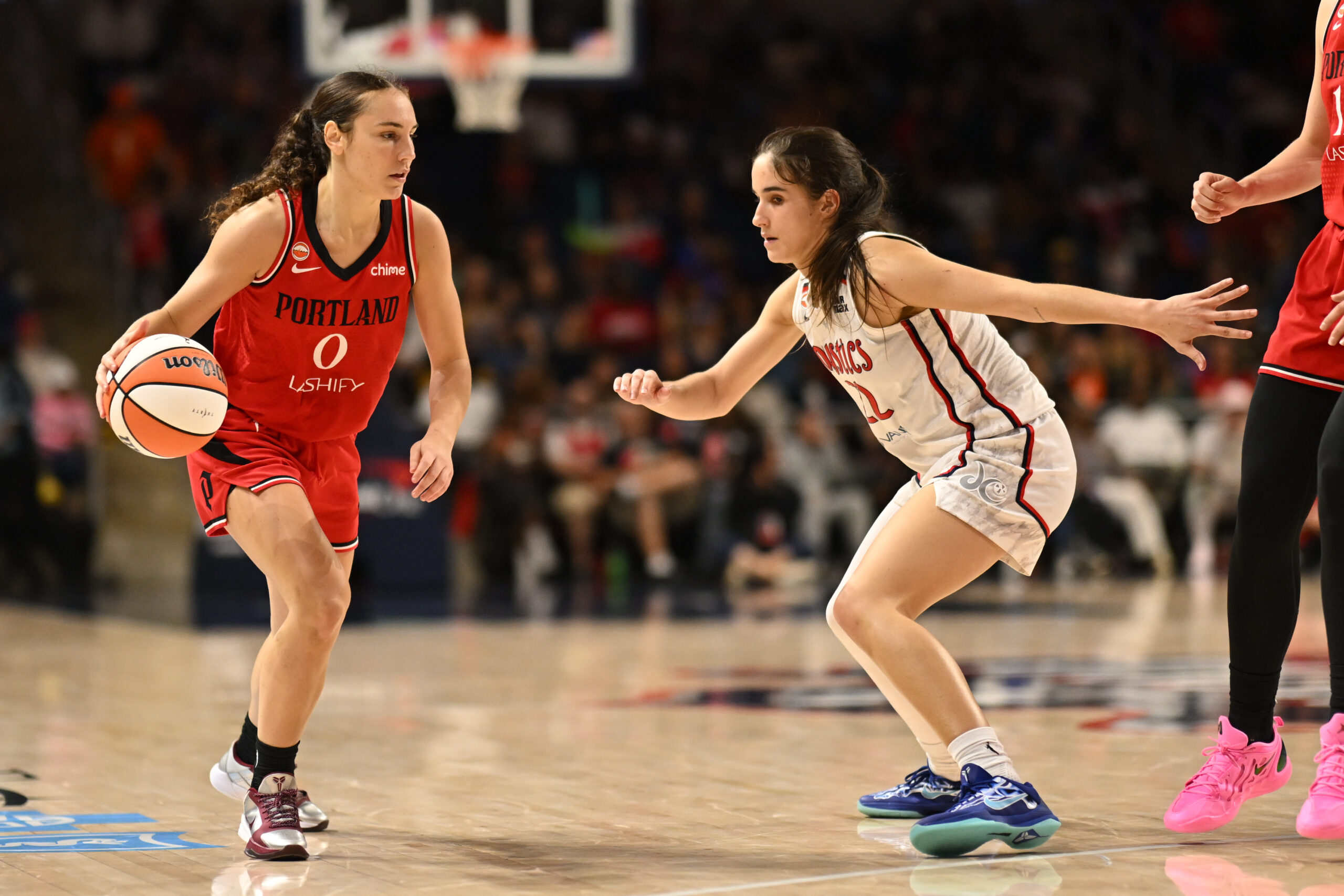 Jun 28, 2026; Washington, District of Columbia, USA; Portland Fire guard Carla Leite (0) dribbles. The ball in front of Washington Mystics guard Sonia Citron (22) during the fourth quarter at CareFirst Arena. Mandatory Credit: Rafael Suanes-Imagn Images