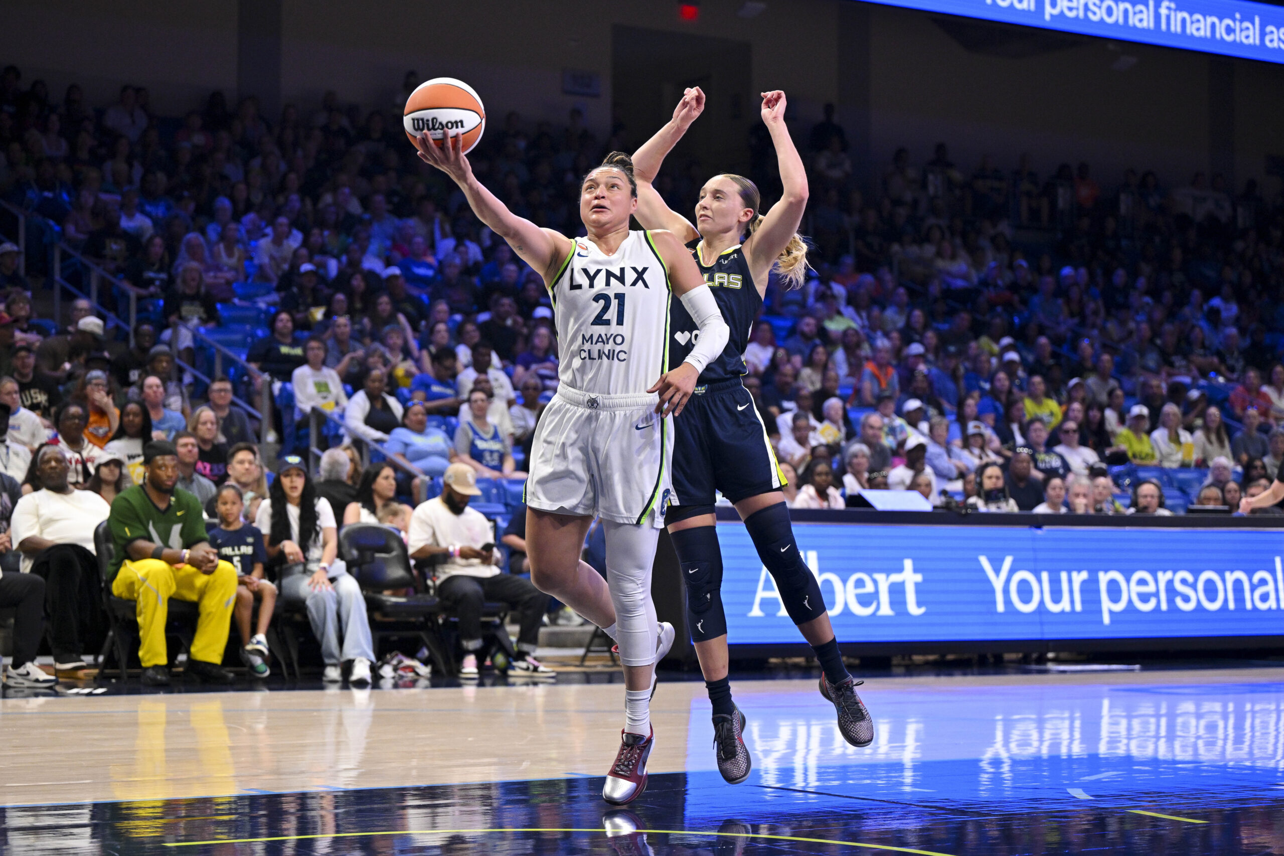 Jun 28, 2026; Arlington, Texas, USA; Minnesota Lynx guard Kayla McBride (21) and Dallas Wings guard Paige Bueckers (5) in action during the game between the Wings and the Lynx at College Park Center. Mandatory Credit: Jerome Miron-Imagn Images