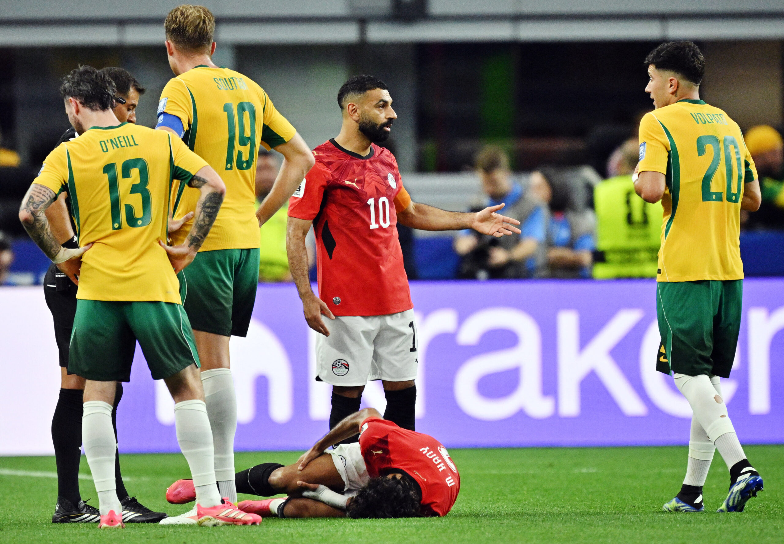 July 3, 2026; Arlington, Texas, U.S.; Egypt's Mohamed Salah and Australia's Cristian Volpato react as Egypt's Mohamed Hany is down after sustaining an injury.  Mandatory Credit: Jerome Miron-Imagn Images