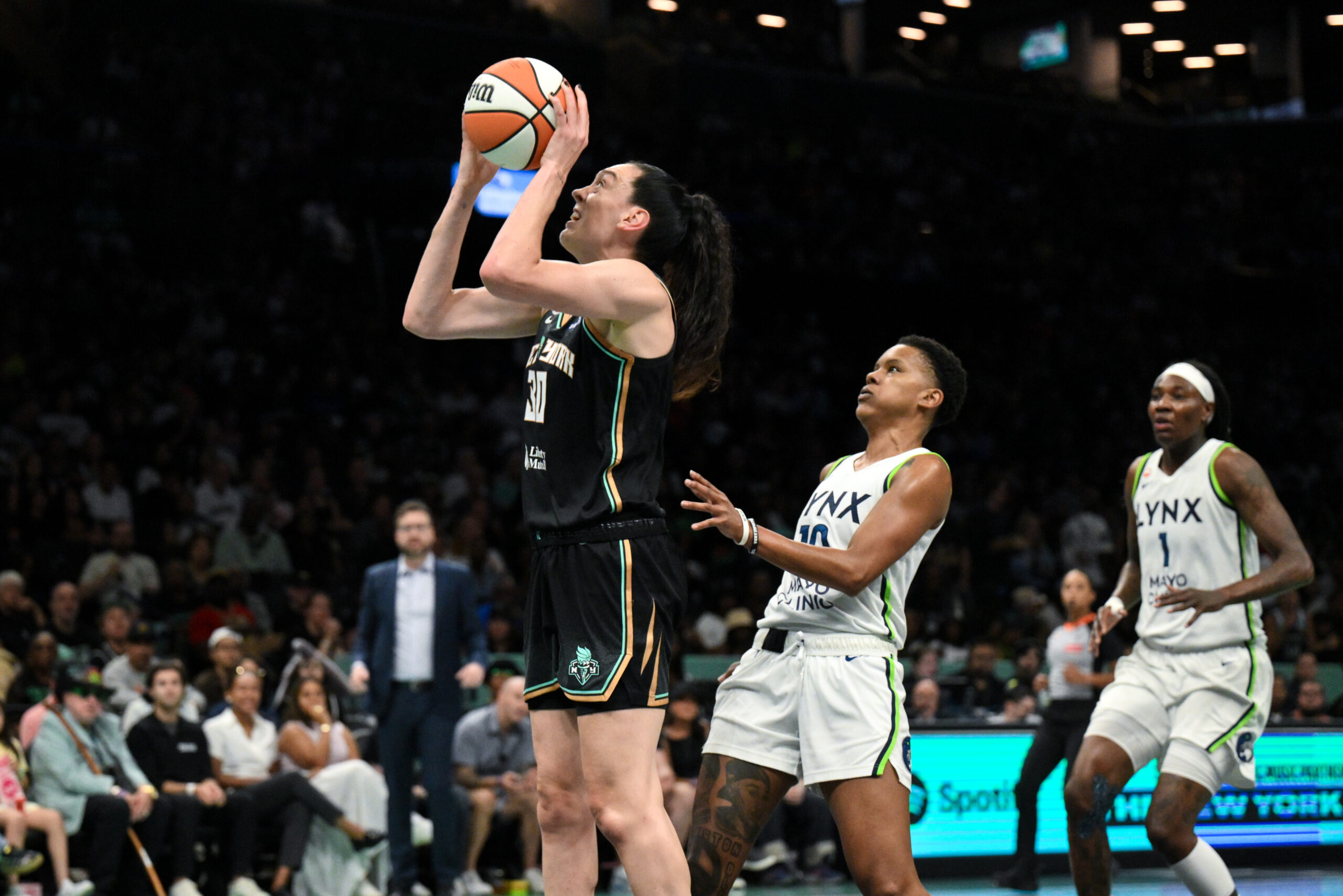 Jul 3, 2026; Brooklyn, New York, USA; New York Liberty forward Breanna Stewart (30) shoots the ball while defended by Minnesota Lynx guard Courtney Williams (10) during the first half at Barclays Center. Mandatory Credit: John Jones-Imagn Images