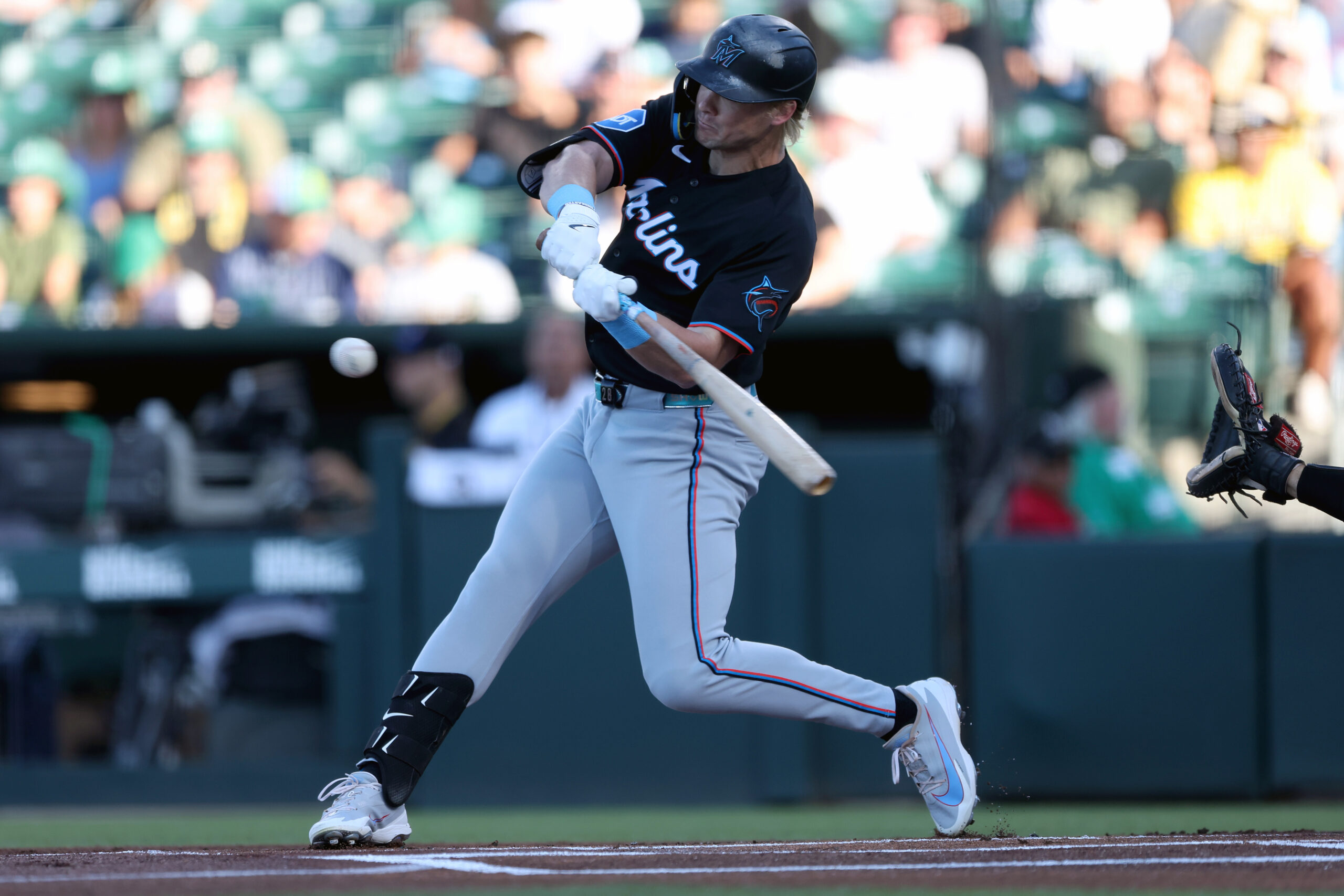 Jul 3, 2026; West Sacramento, California, USA; Miami Marlins first baseman Kyle Stowers (28) hits a single against the Athletics during the first inning at Sutter Health Park. Mandatory Credit: Dennis Lee-Imagn Images