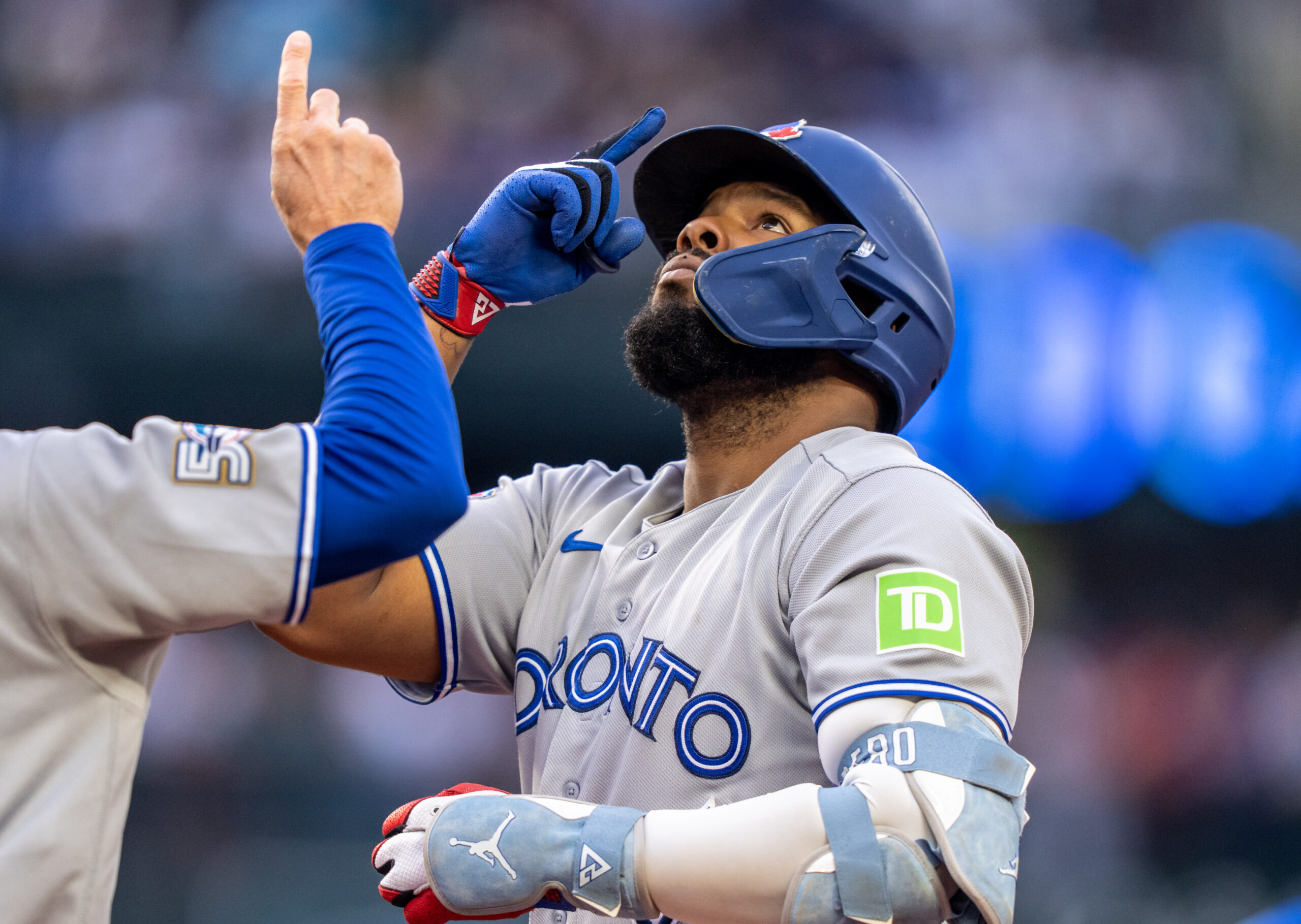 Jul 3, 2026; Seattle, Washington, USA;  Toronto Blue Jays first baseman Vladimir Guerrero Jr. (27) celebrates at first base after hitting a RBI-single during the third inning against the Seattle Mariners at T-Mobile Park. Mandatory Credit: Stephen Brashear-Imagn Images
