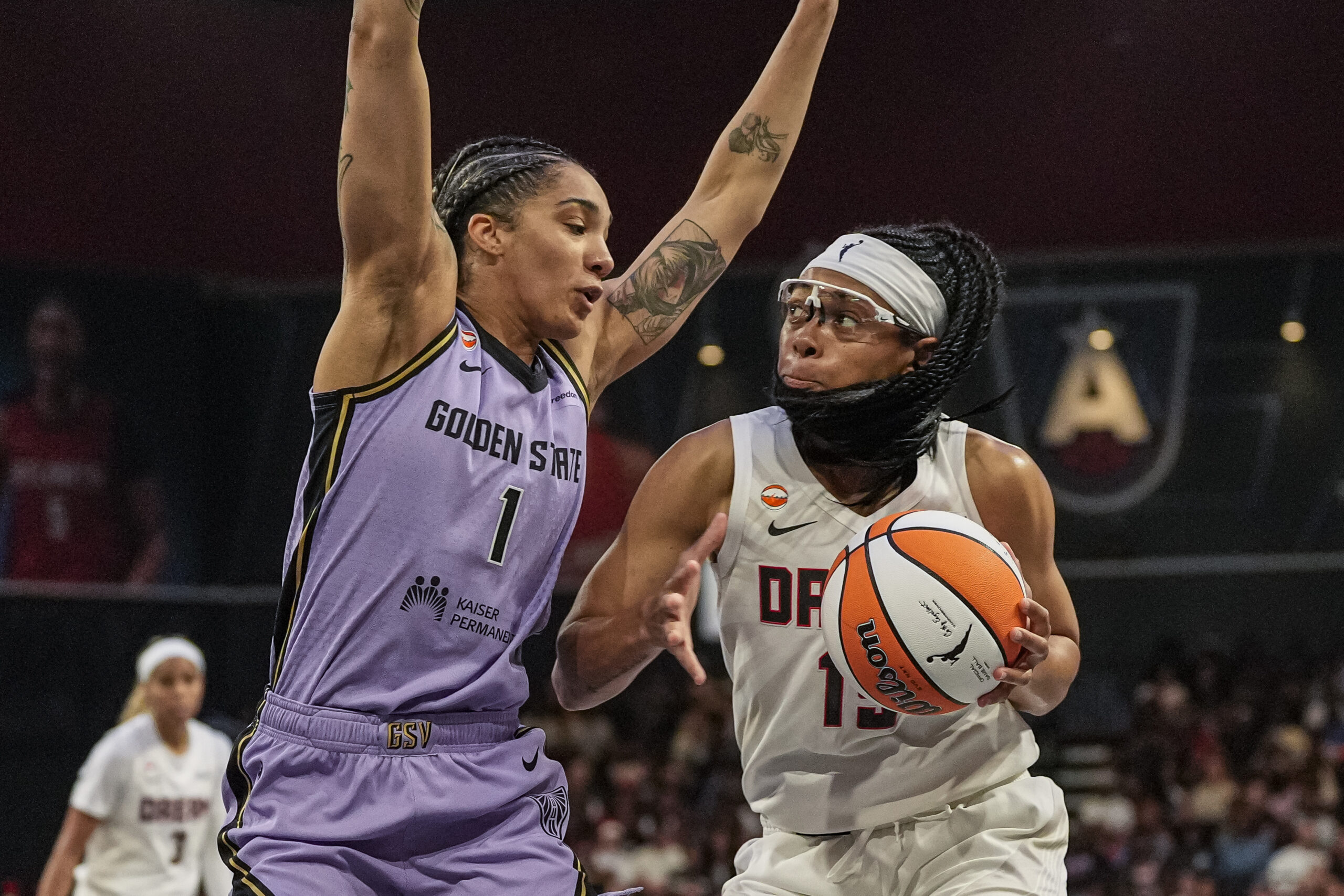 Jul 4, 2026; College Park, Georgia, USA; Atlanta Dream guard Allisha Gray (15) controls the ball against Golden State Valkyries forward Gabby Williams (1) during the first half at Gateway Center Arena at College Park. Mandatory Credit: Dale Zanine-Imagn Images