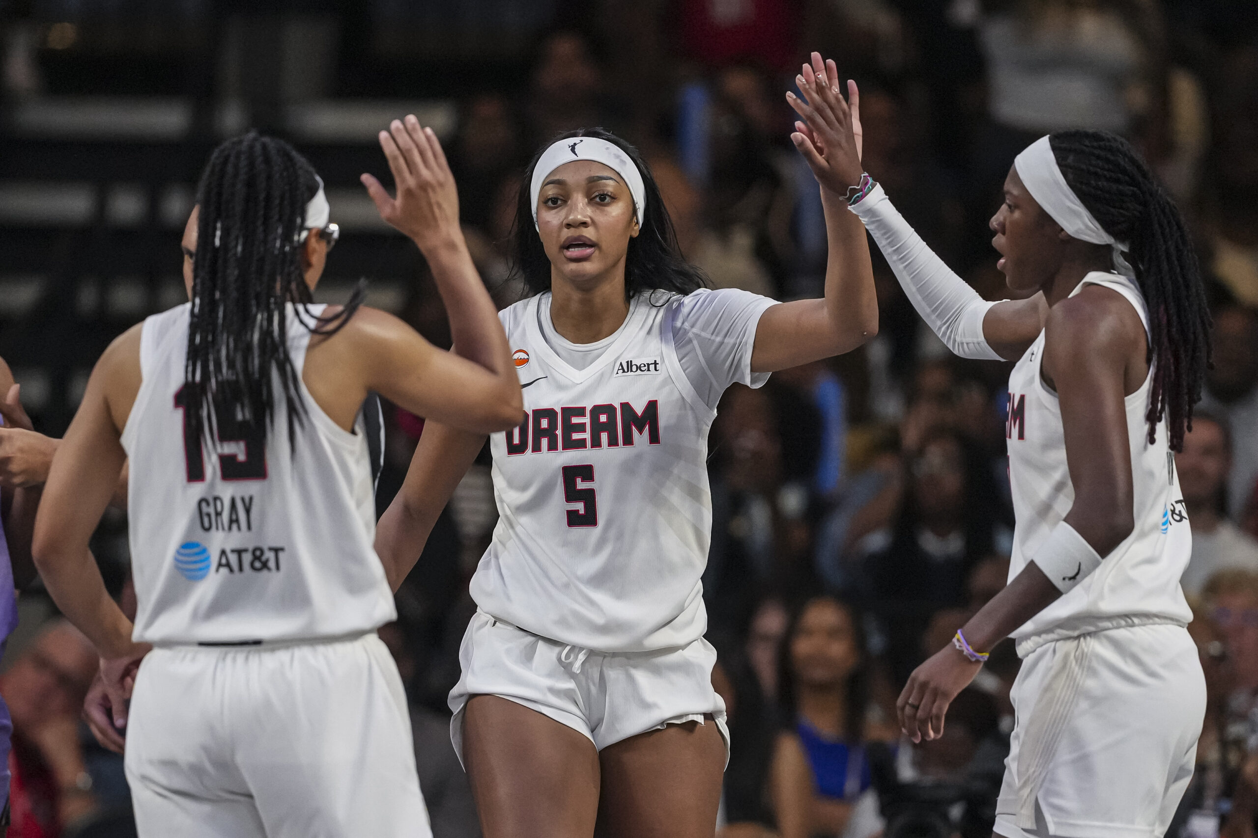 Jul 4, 2026; College Park, Georgia, USA; Atlanta Dream forward Angel Reese (5) react with guard Allisha Gray (15) and guard Rhyne Howard (10) against the Golden State Valkyries during the second half at Gateway Center Arena at College Park. Mandatory Credit: Dale Zanine-Imagn Images