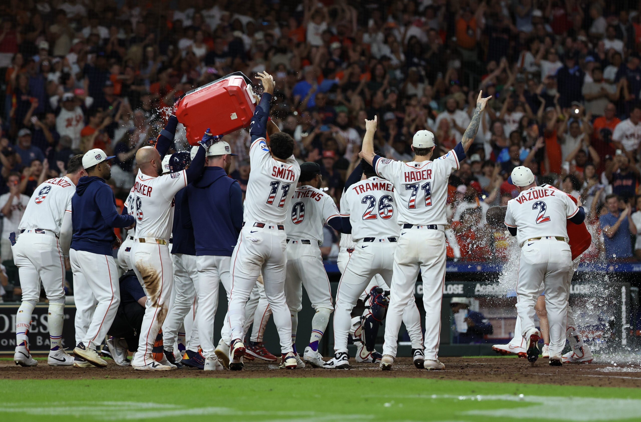 Jul 4, 2026; Houston, Texas, USA; Houston Astros players celebrate after designated hitter Yordan Alvarez (44) hit a two-run game-winning home run against the Tampa Bay Rays in the ninth inning at Daikin Park. Mandatory Credit: Thomas Shea-Imagn Images
