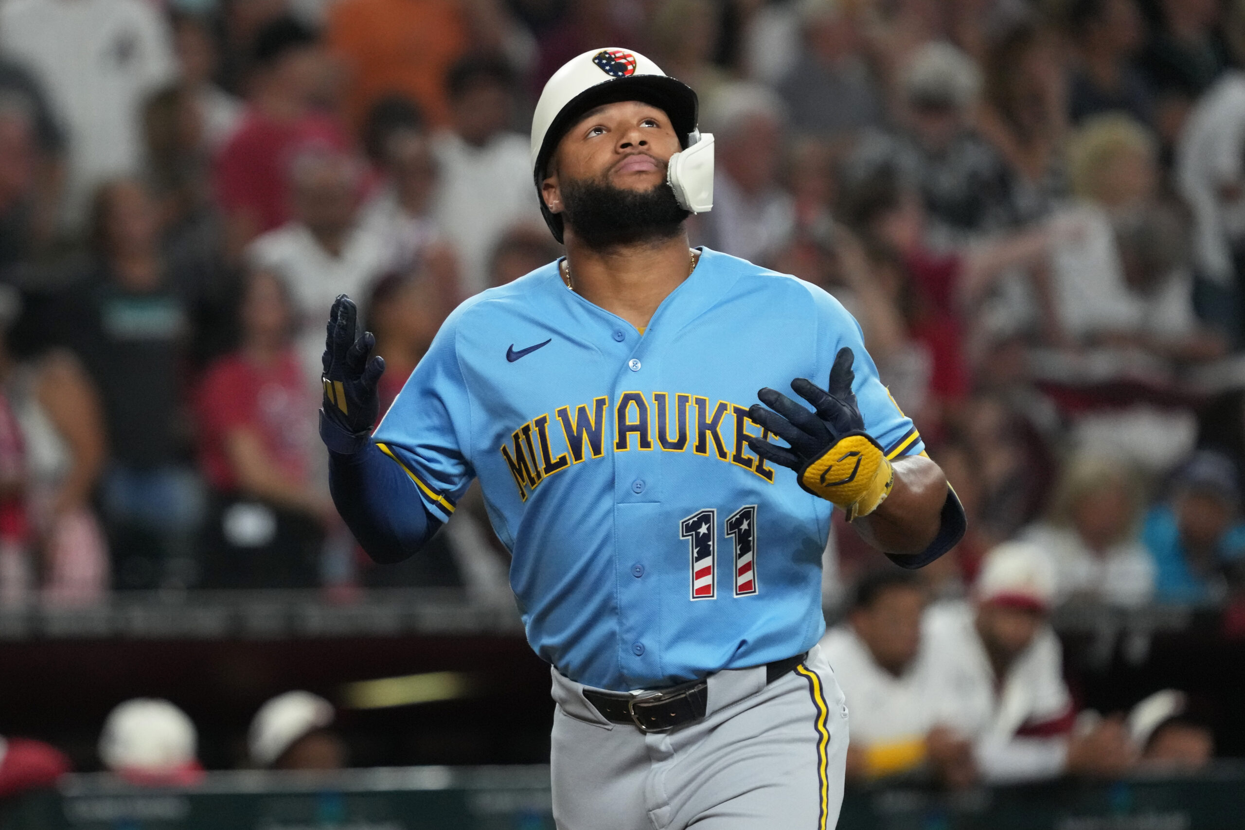 Jul 4, 2026; Phoenix, Arizona, USA; Milwaukee Brewers left fielder Jackson Chourio (11) hits a home run against the Arizona Diamondbacks in the ninth inning at Chase Field. Mandatory Credit: Rick Scuteri-Imagn Images