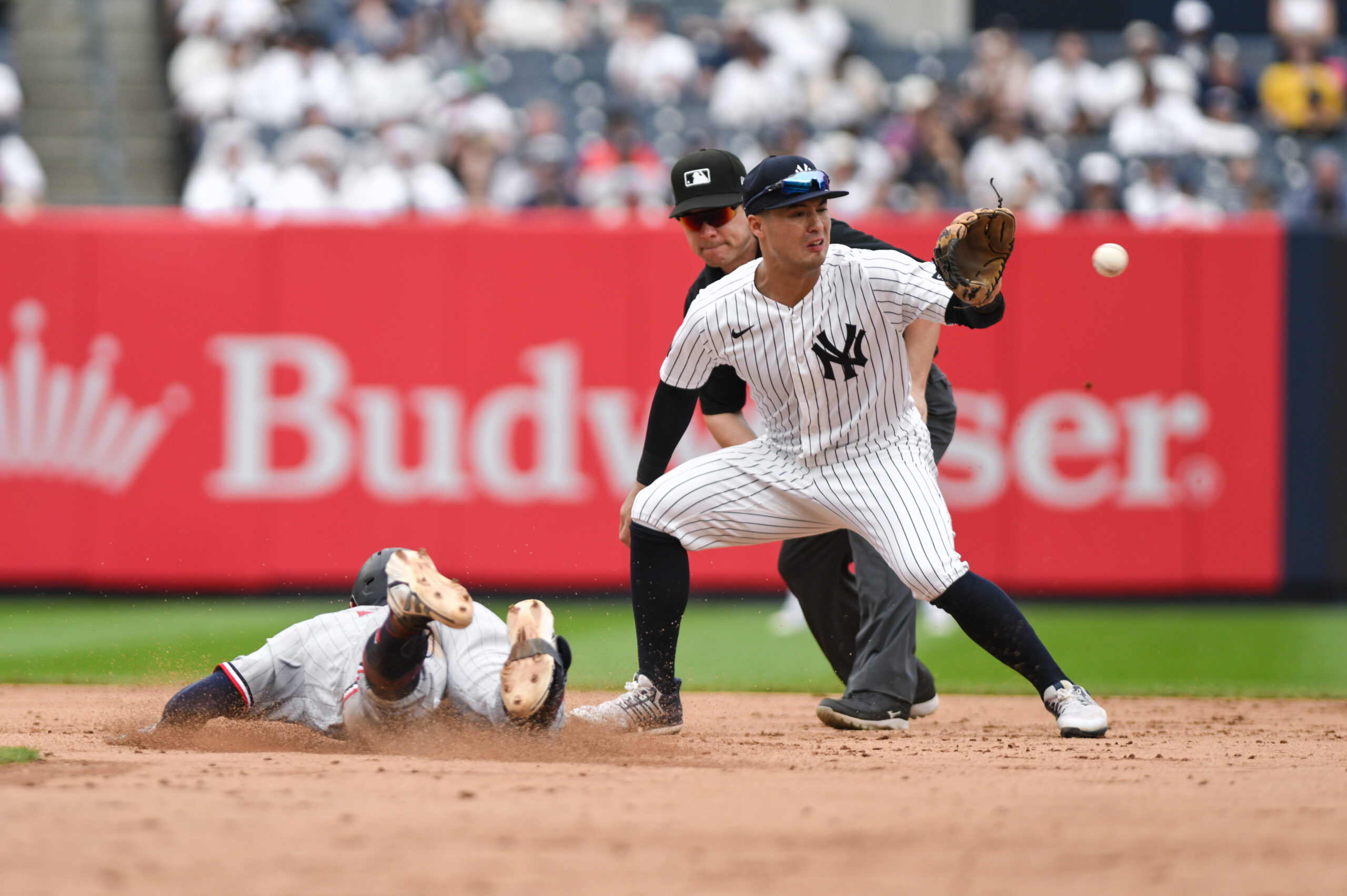 Jul 5, 2026; Bronx, New York, USA; Minnesota Twins shortstop Brooks Lee (22) slides safely into second base with a double ahead of the throw to New York Yankees shortstop Anthony Volpe (11) during the sixth inning at Yankee Stadium. Mandatory Credit: John Jones-Imagn Images