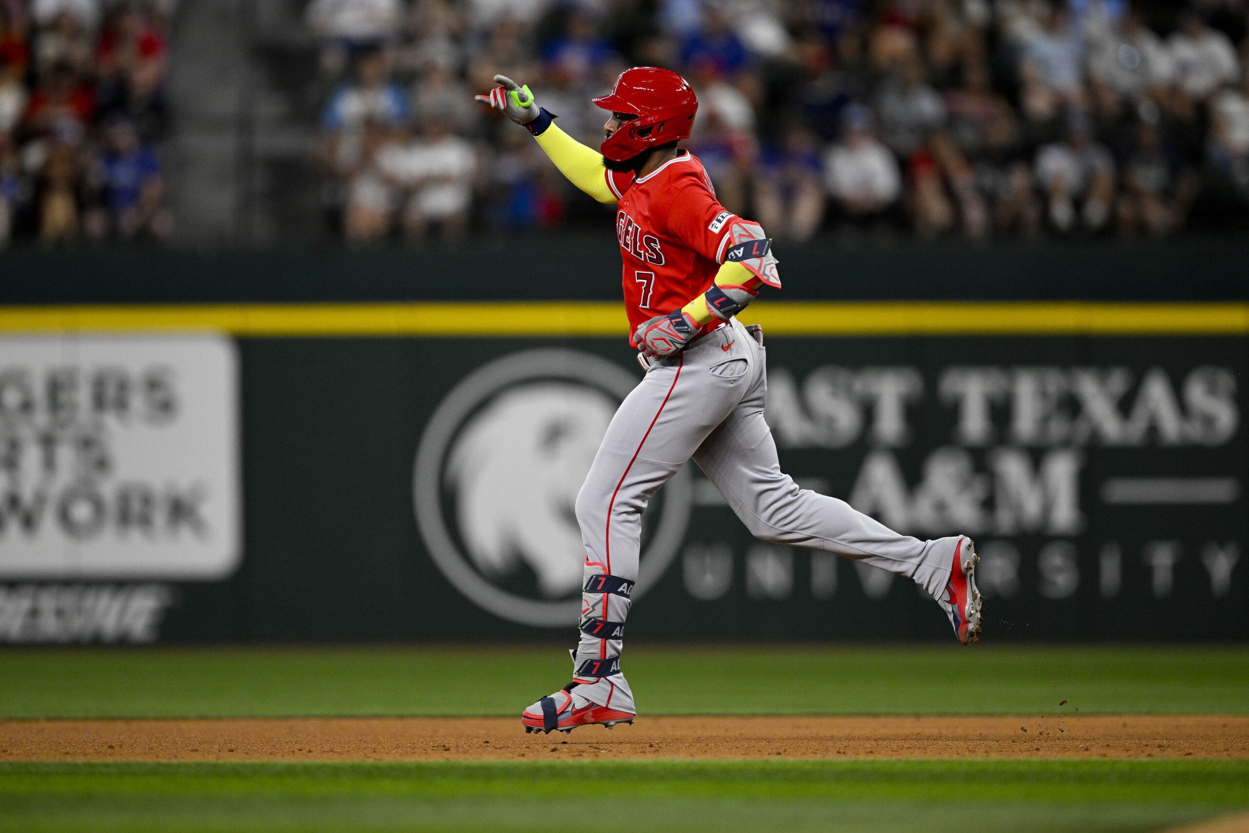 Jul 8, 2026; Arlington, Texas, USA; Los Angeles Angels right fielder Jo Adell (7) rounds the bases after he hits a three run home run against the Texas Rangers during the fifth inning at Globe Life Field. Mandatory Credit: Jerome Miron-Imagn Images