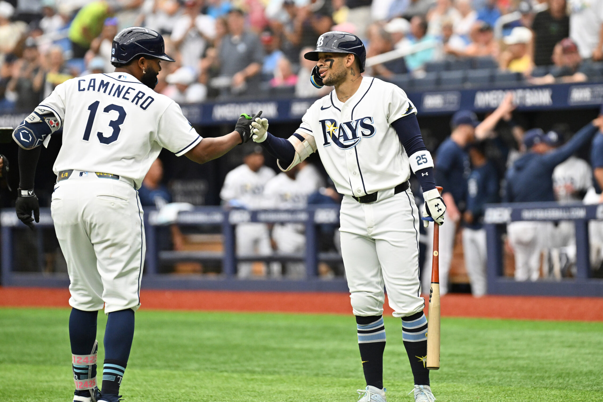 Jul 9, 2026; St. Petersburg, Florida, USA; Tampa Bay Rays third baseman Junior Caminero (13) celebrates with center fielder Victor Mesa Jr. (25) after hitting a solo home run in the first inning against the New York Yankees at Tropicana Field. Mandatory Credit: Jonathan Dyer-Imagn Images