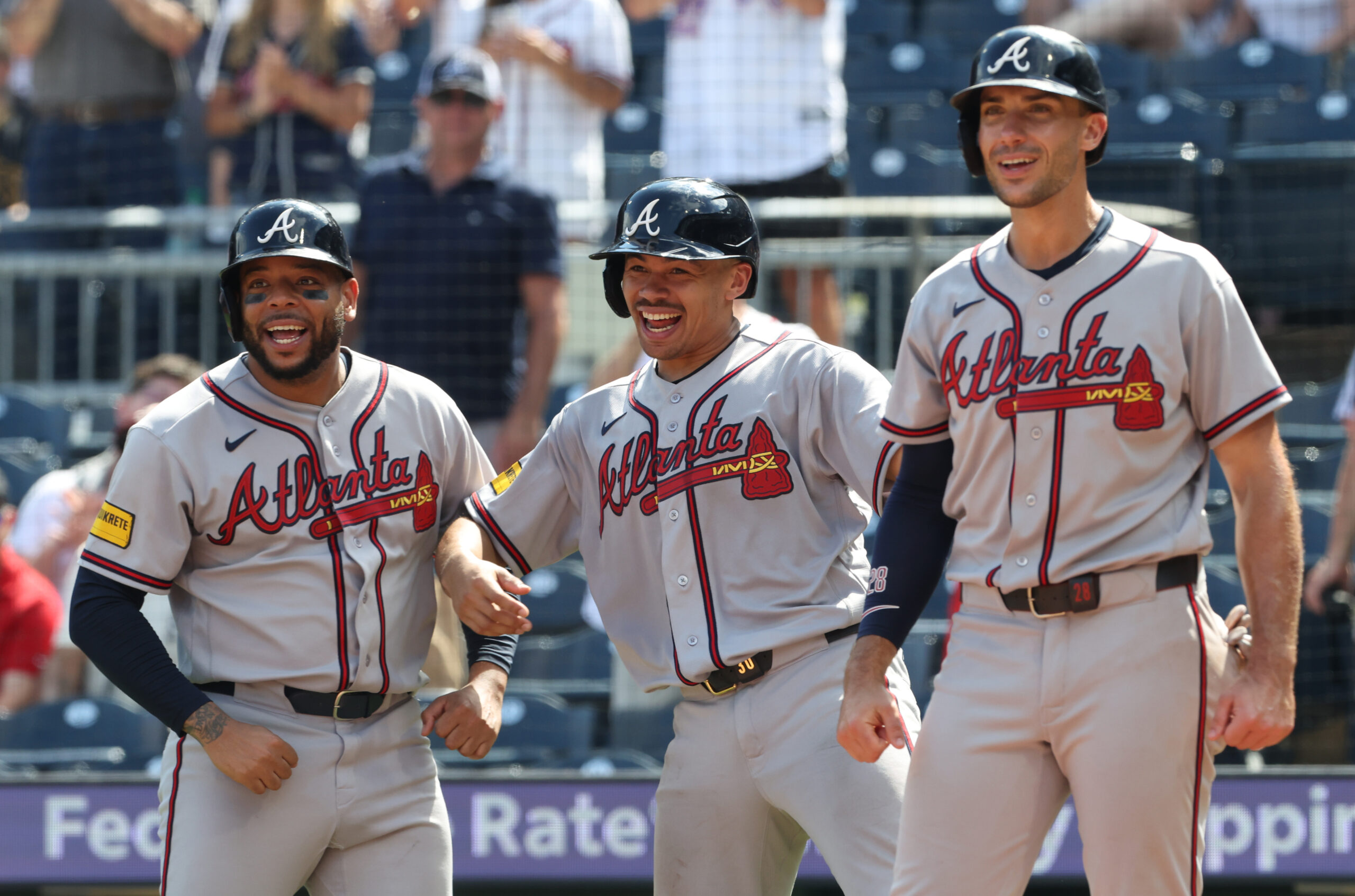 Jul 9, 2026; Pittsburgh, Pennsylvania, USA;  Atlanta Braves designated hitter Dominic Smith (left) and catcher Drake Baldwin (middle) and first baseman Matt Olson (right) react to a grand slam home run by right fielder Mike Yastrzemski (not pictured) against the Pittsburgh Pirates during the ninth inning at PNC Park. Mandatory Credit: Charles LeClaire-Imagn Images